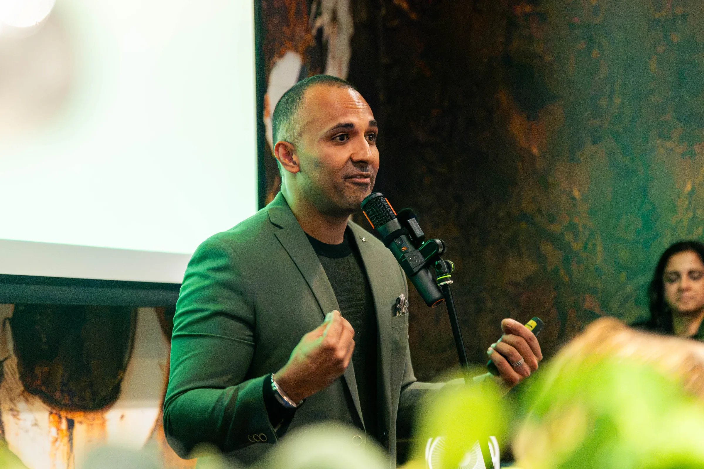 A speaker on the mic at a Perth event, event coverage by Growth Concept Media. A speaker on the mic at a Perth event, event coverage by Growth Concept Media.