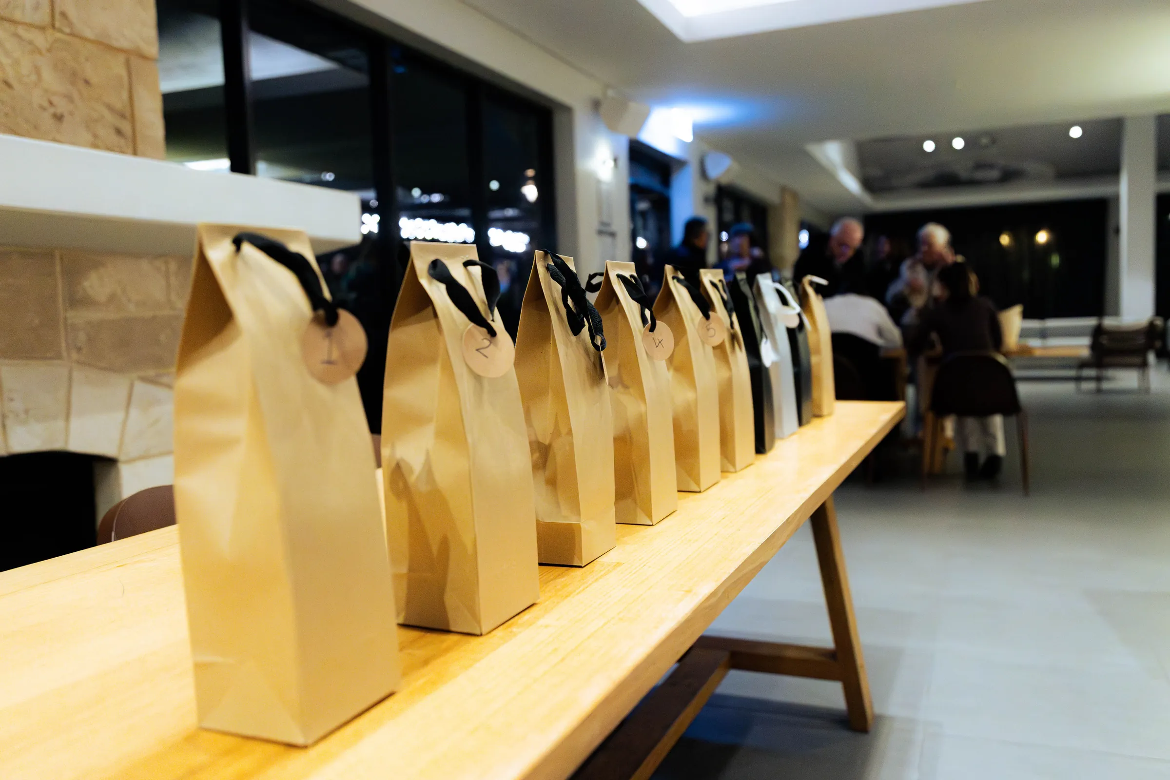 Gift bags lined up on a table at the Armed For Life quiz night at The Hall, The Camfield, Burswood.