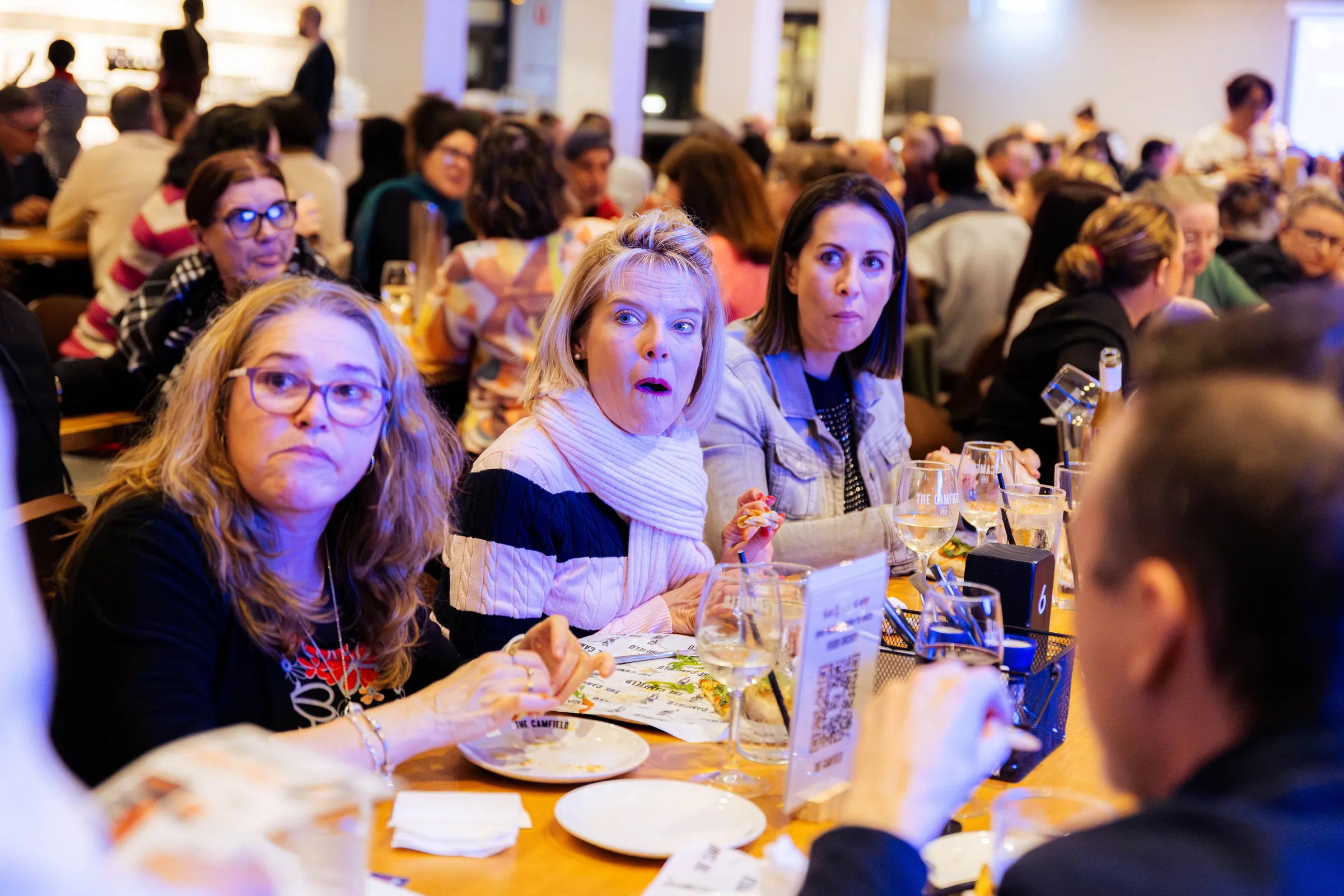 Guests with answer sheets at the Armed For Life quiz night at The Hall, The Camfield, Burswood.