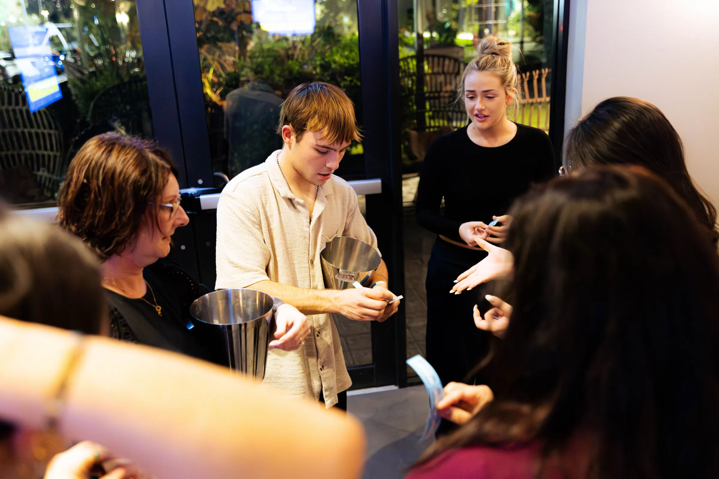 Guests gathered with metal buckets at the Armed For Life quiz night at The Hall, The Camfield, Burswood.