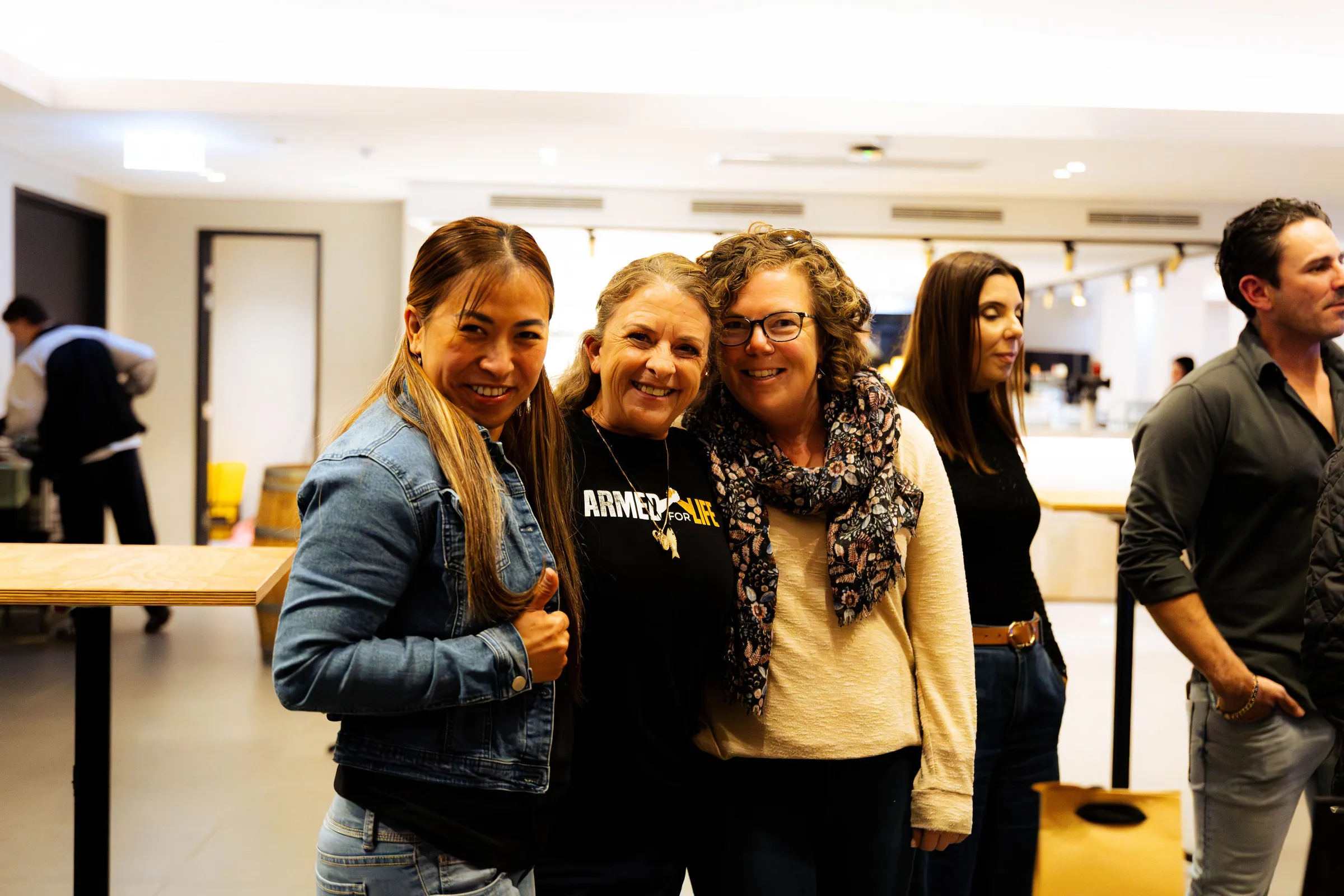Guests posing at the Armed For Life quiz night at The Hall, The Camfield, Burswood.
