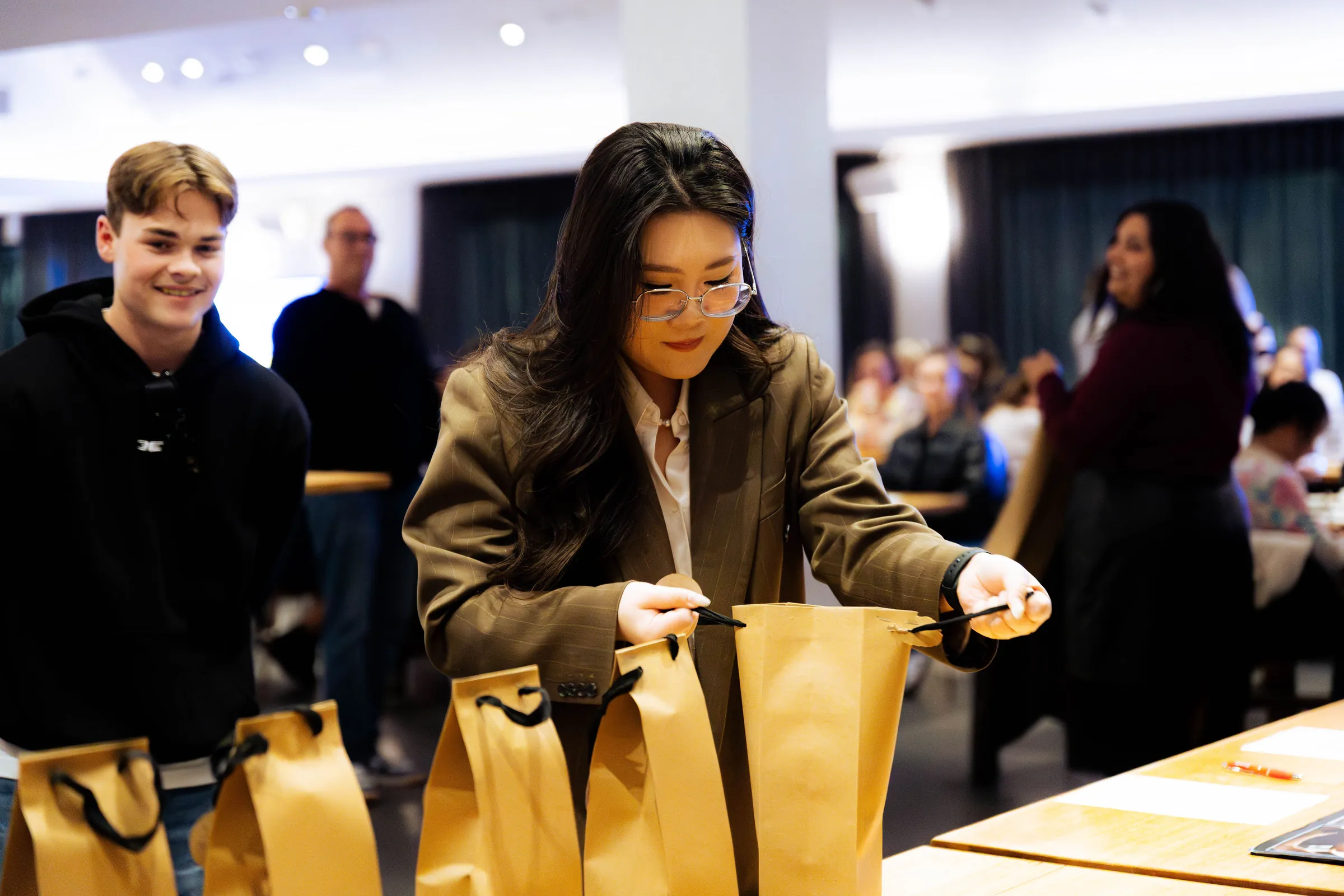 A guest looking through gift bags at the Armed For Life quiz night at The Hall, The Camfield, Burswood.