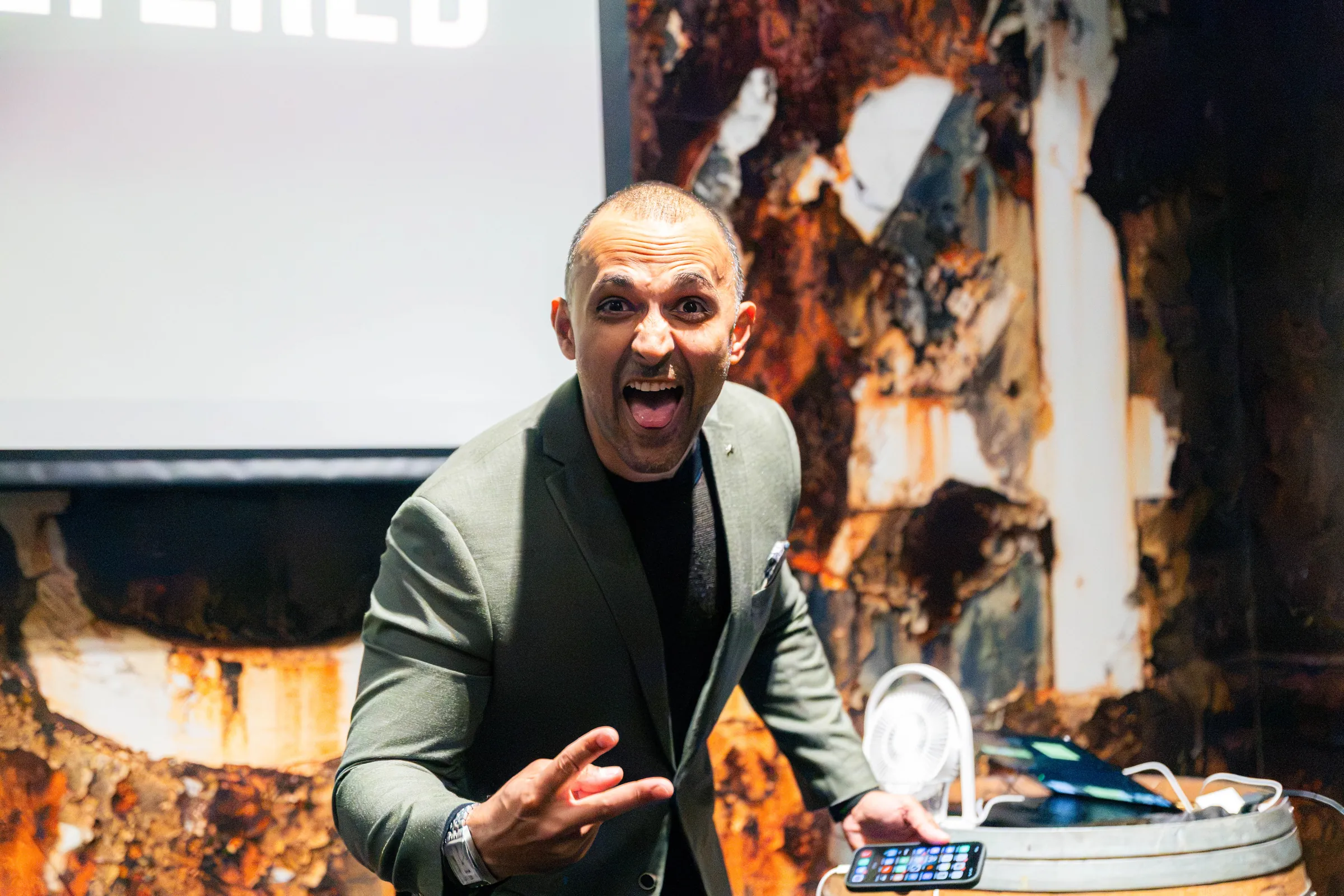 A speaker on stage at a Perth event.
