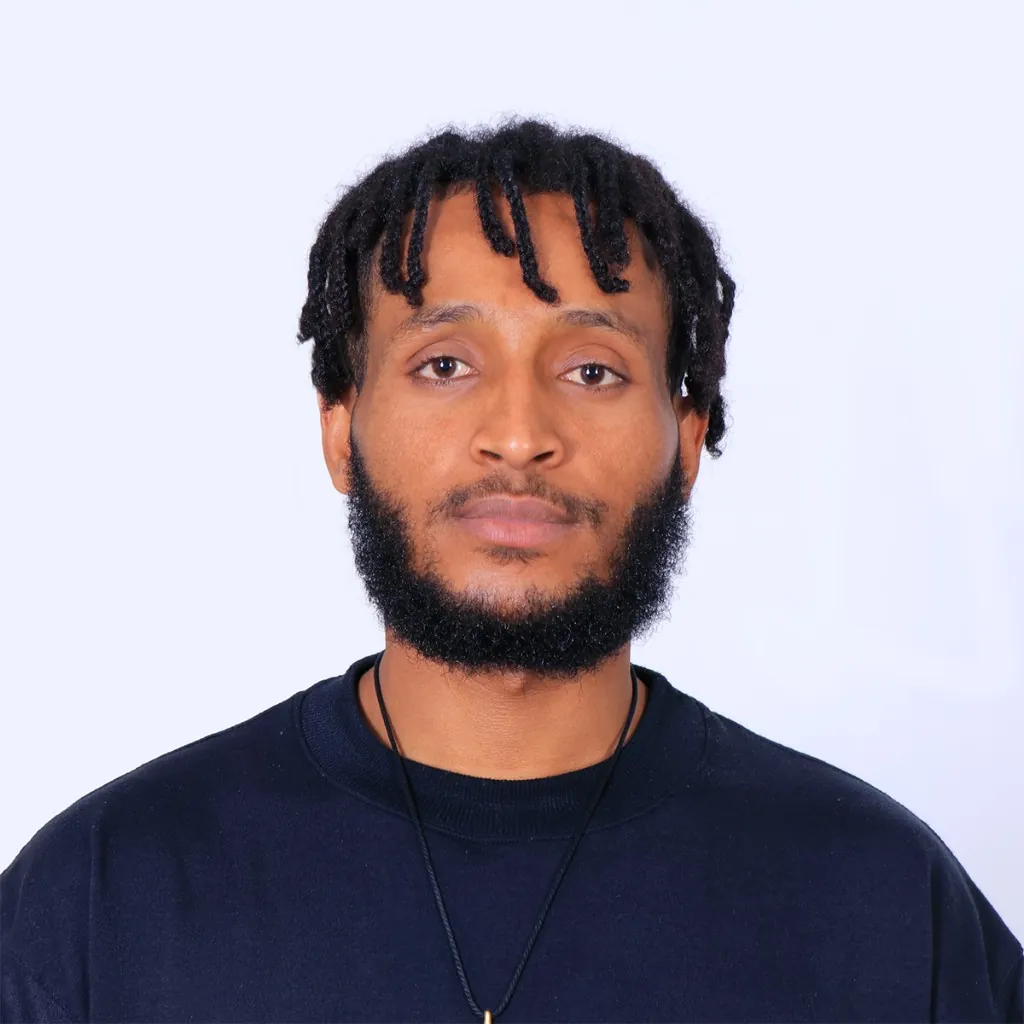 A headshot of William Tekle.