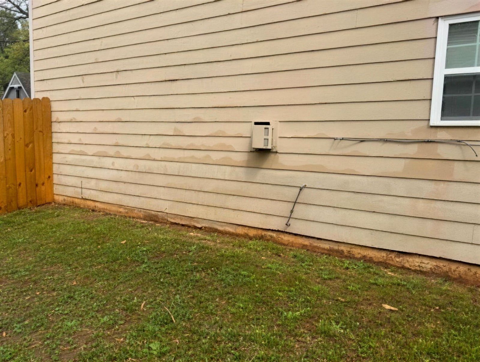 The same exterior wall with rust staining removed after treatment