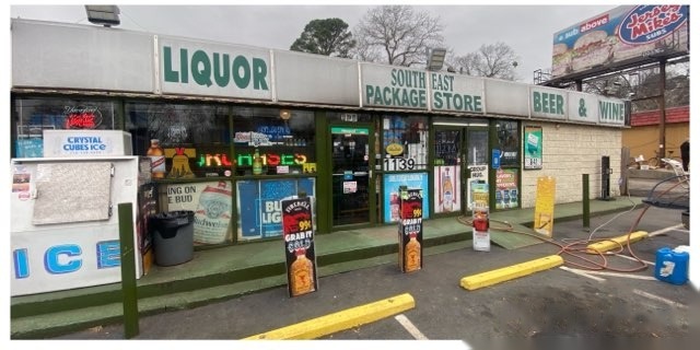 The same storefront, sidewalk curb and walkway clean after commercial pressure washing