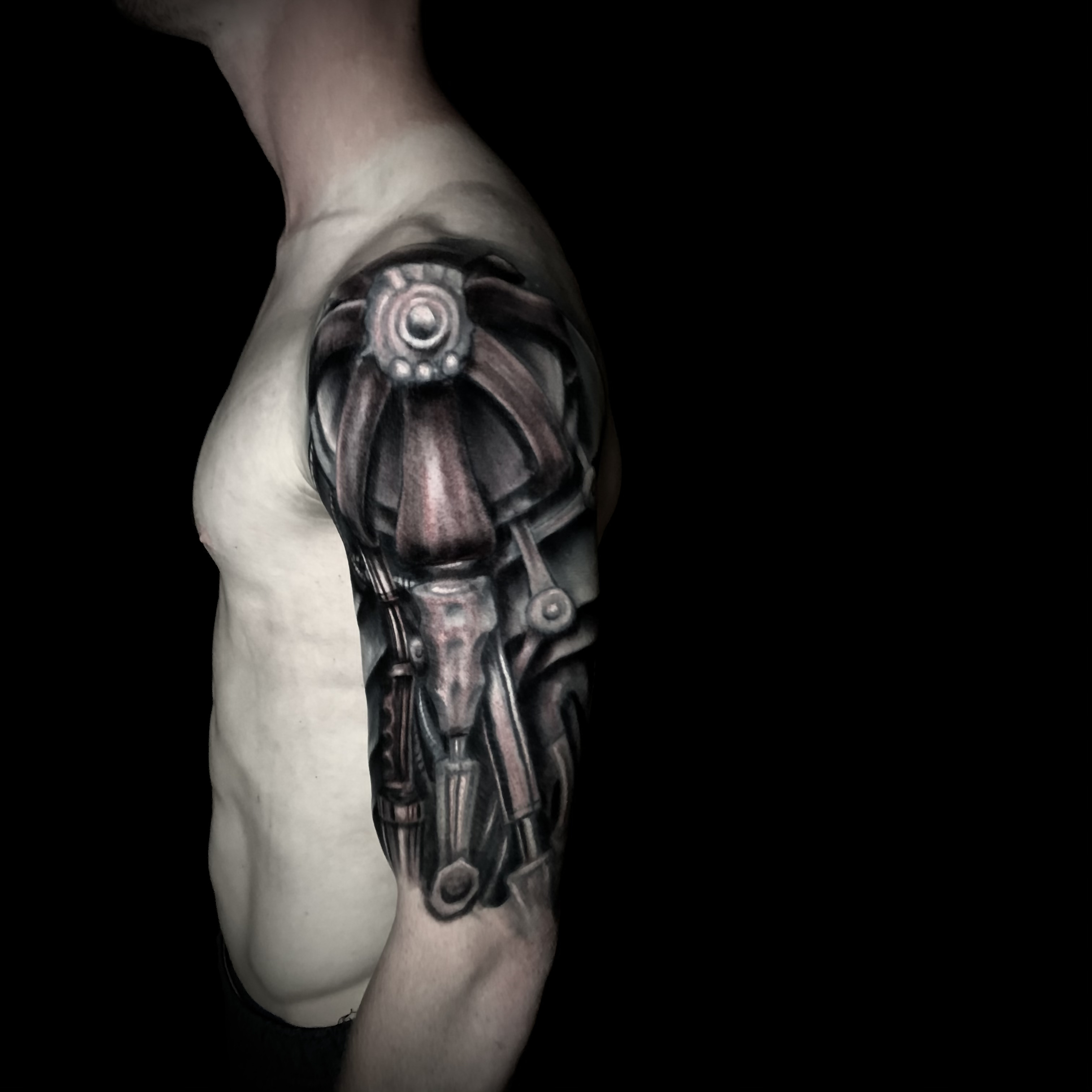 Biomechanical black and grey sleeve, shoulder view, by Chucky Holden