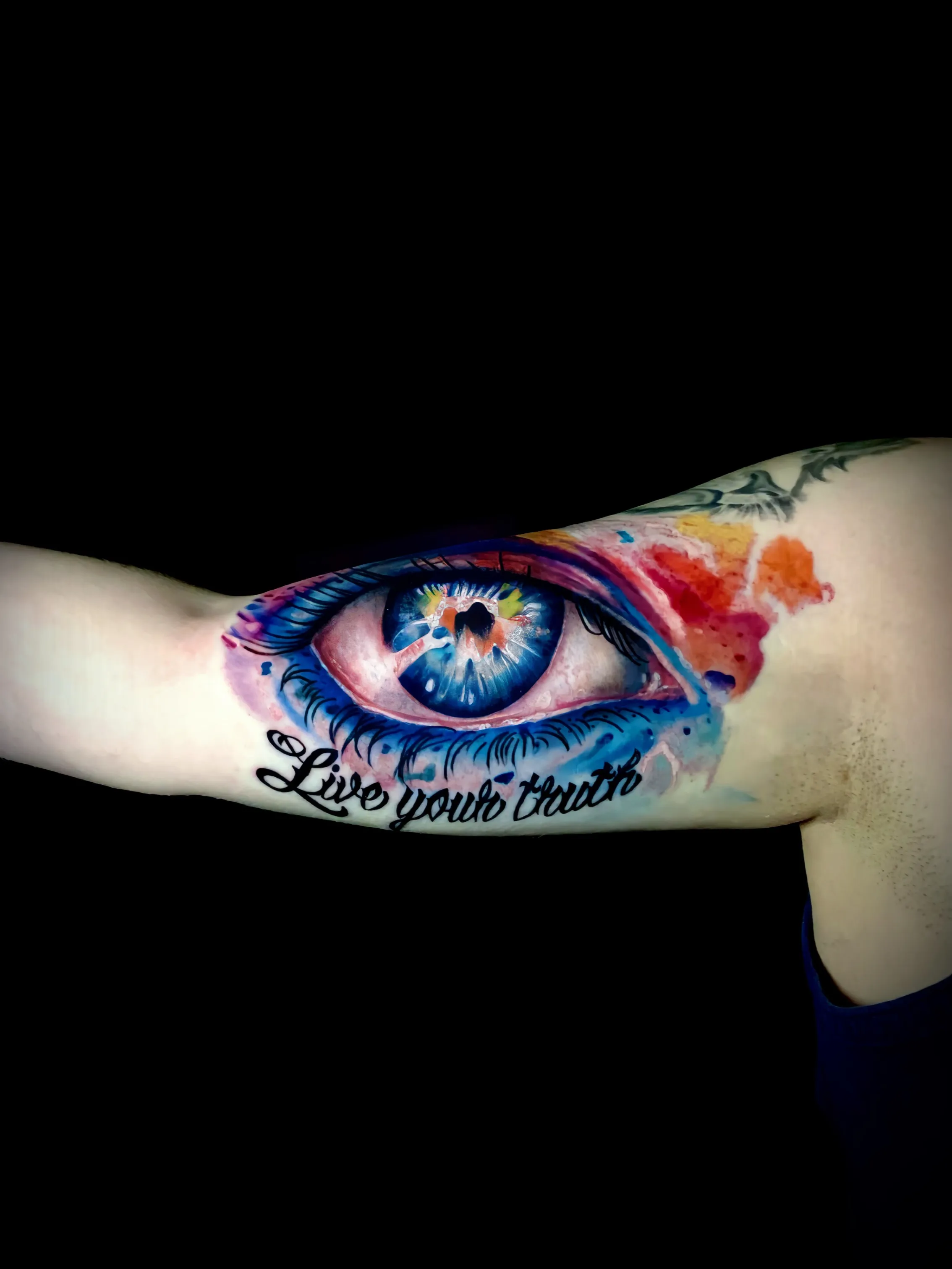 Color realism eye and script tattoo
