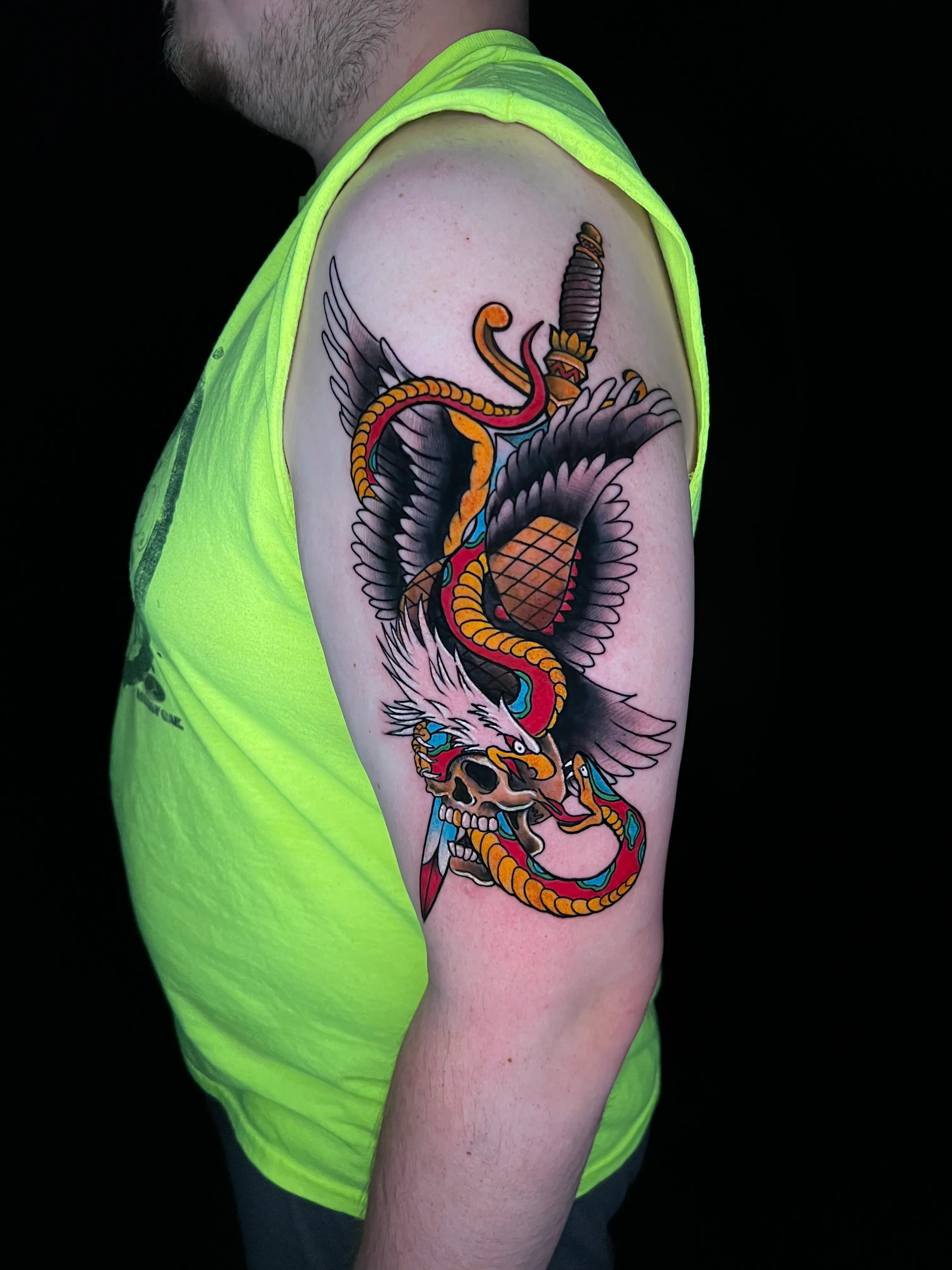 Traditional snake and dagger color tattoo by Chucky Holden