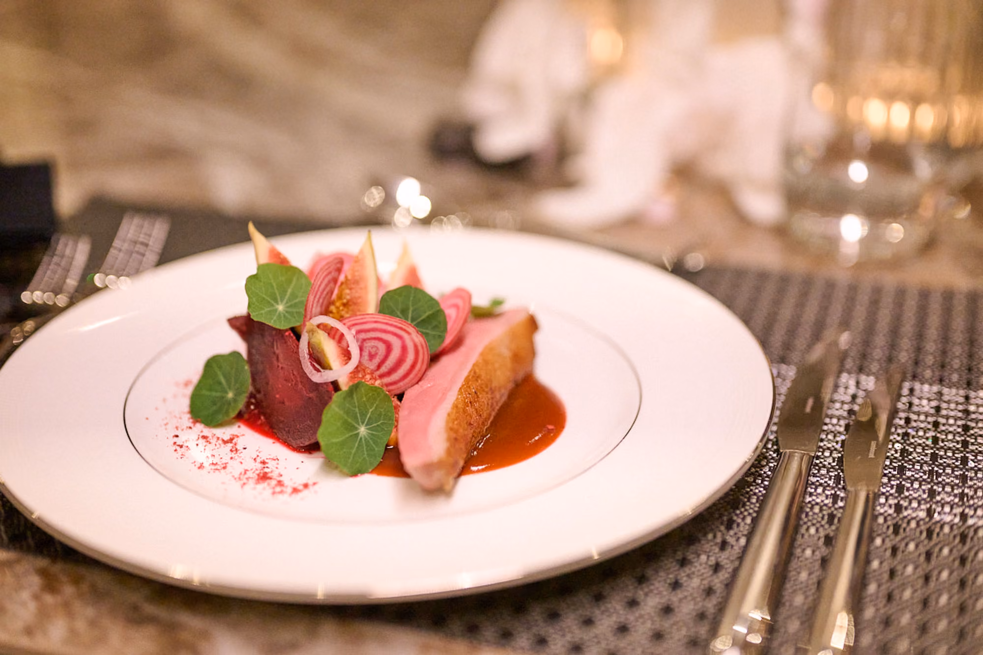 Belle's crew member presenting a dish