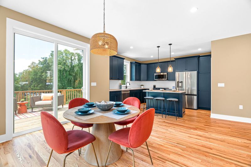 Dining area opening to the deck and kitchen