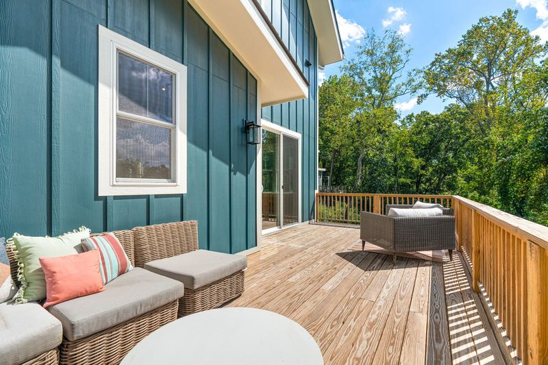 Deck along the board-and-batten siding