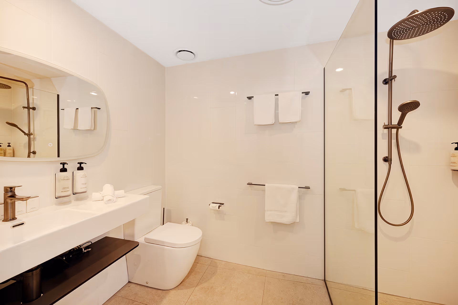 The Garden Queen Room bathroom, with a basin, toilet and walk-in shower.