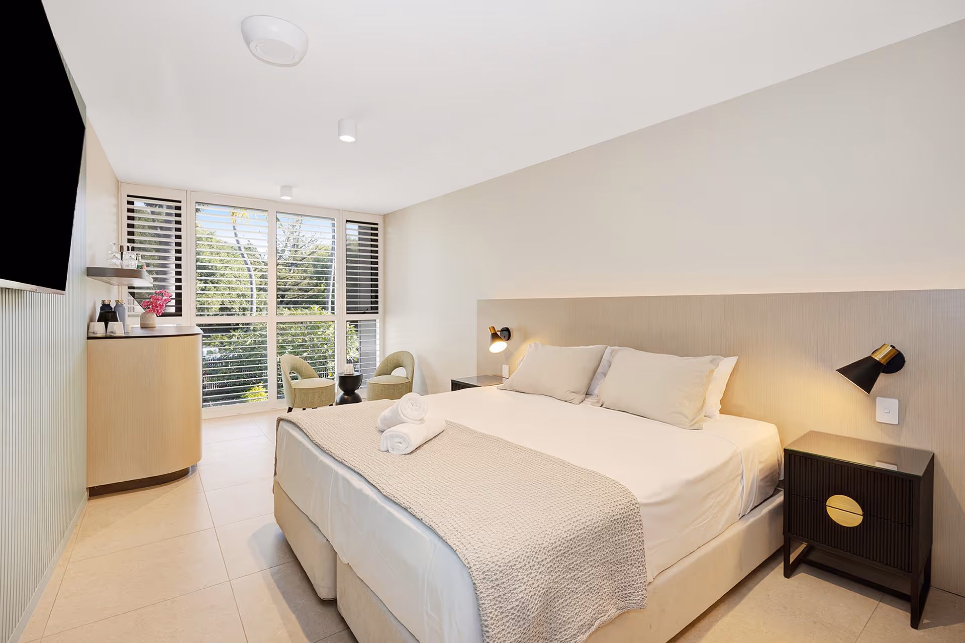 The Garden View Superior Room, with a king bed and seating by the window.