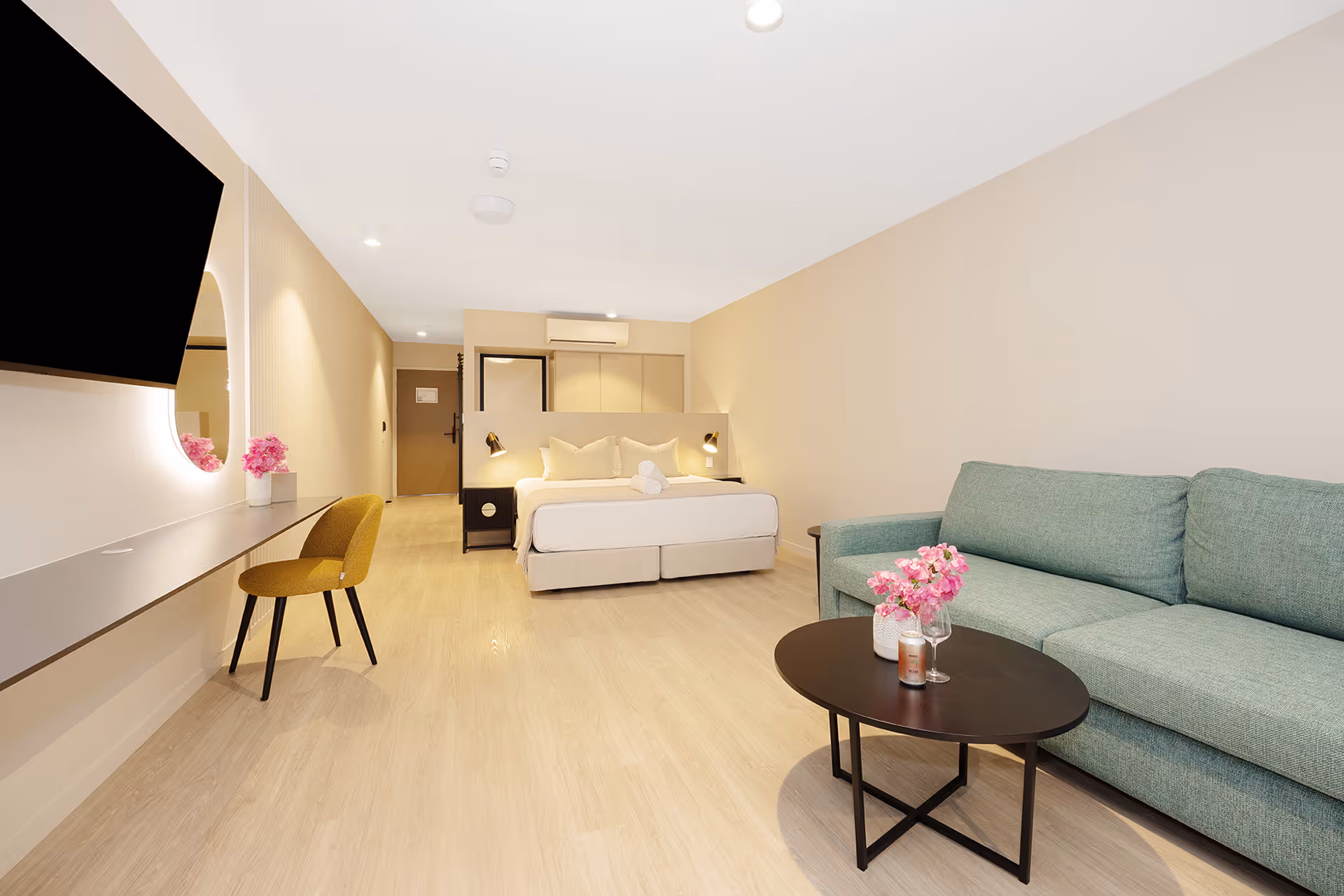 The Superior Palm Room, with a king bed, lounge and sofa that converts to a sofa bed.