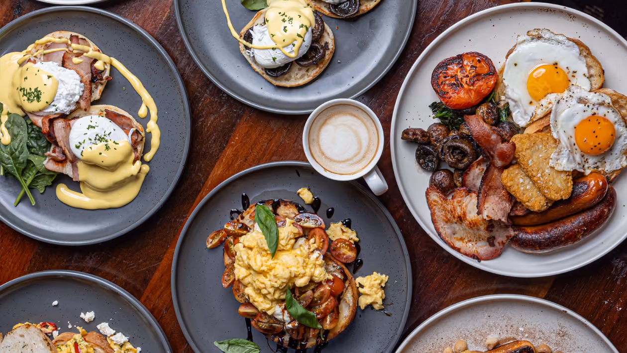 An overhead spread of breakfast dishes and coffee at the R&R Bistro.