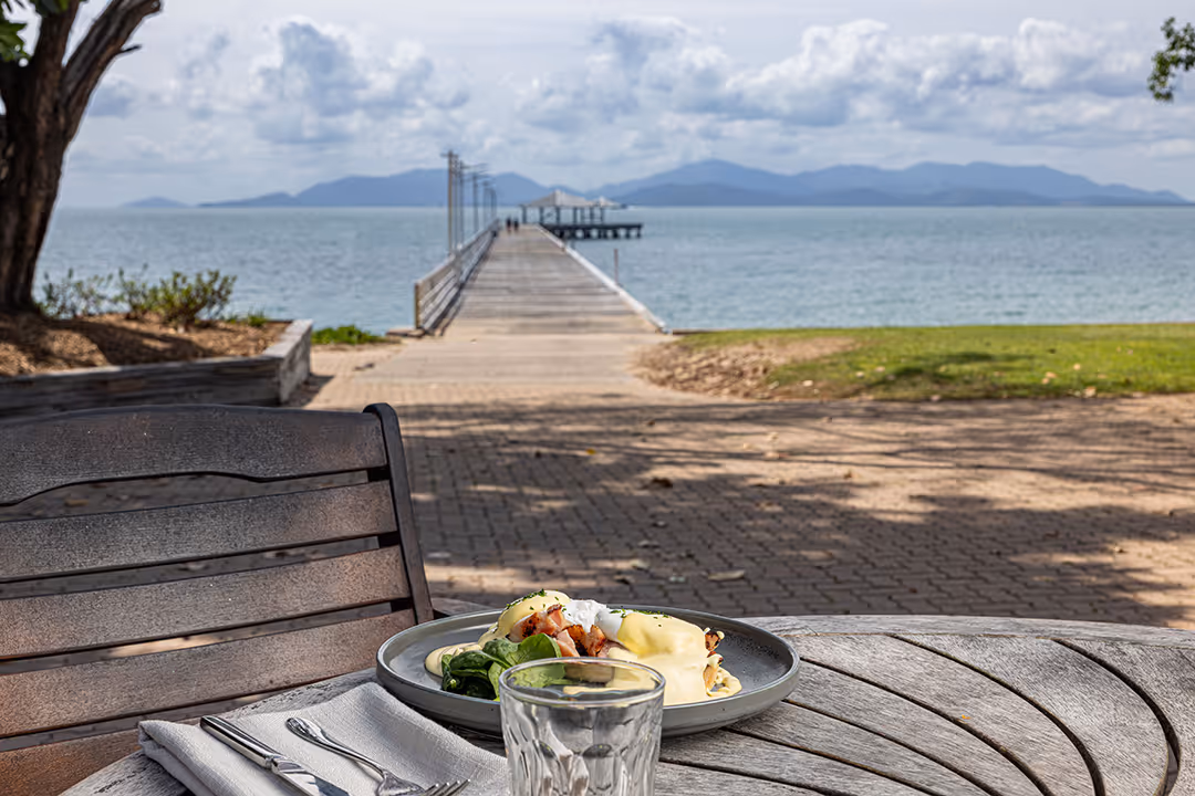 Lunch served at an outdoor table looking out to the Picnic Bay jetty.