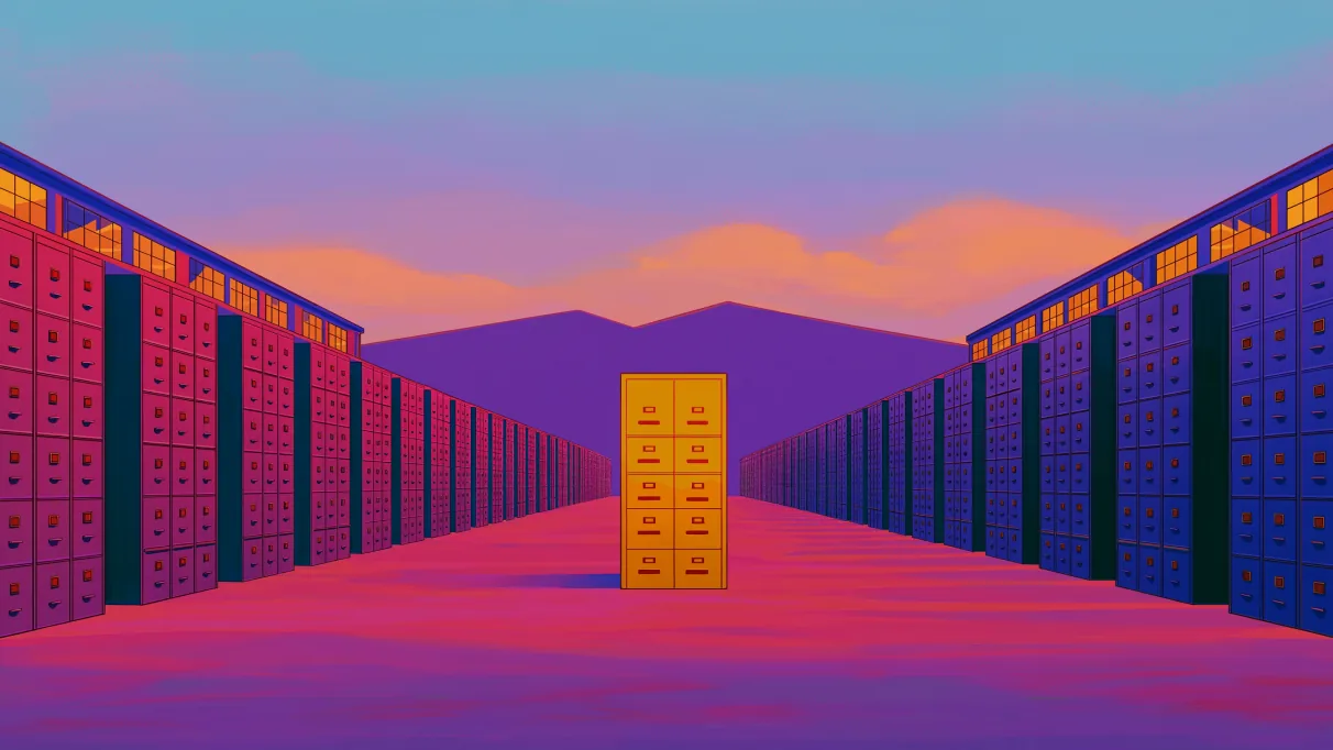 A long aisle between painted walls of filing drawers at dusk, one drawer lit and open at the far end