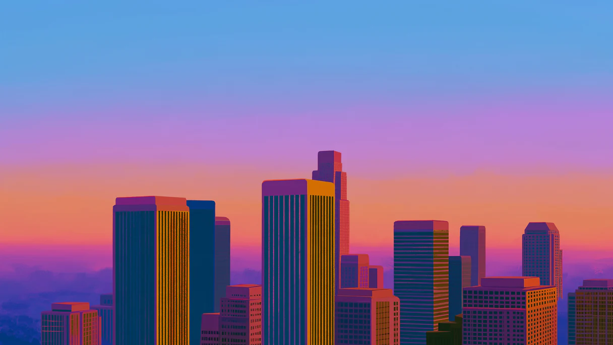 A city skyline glowing orange and violet at sunset