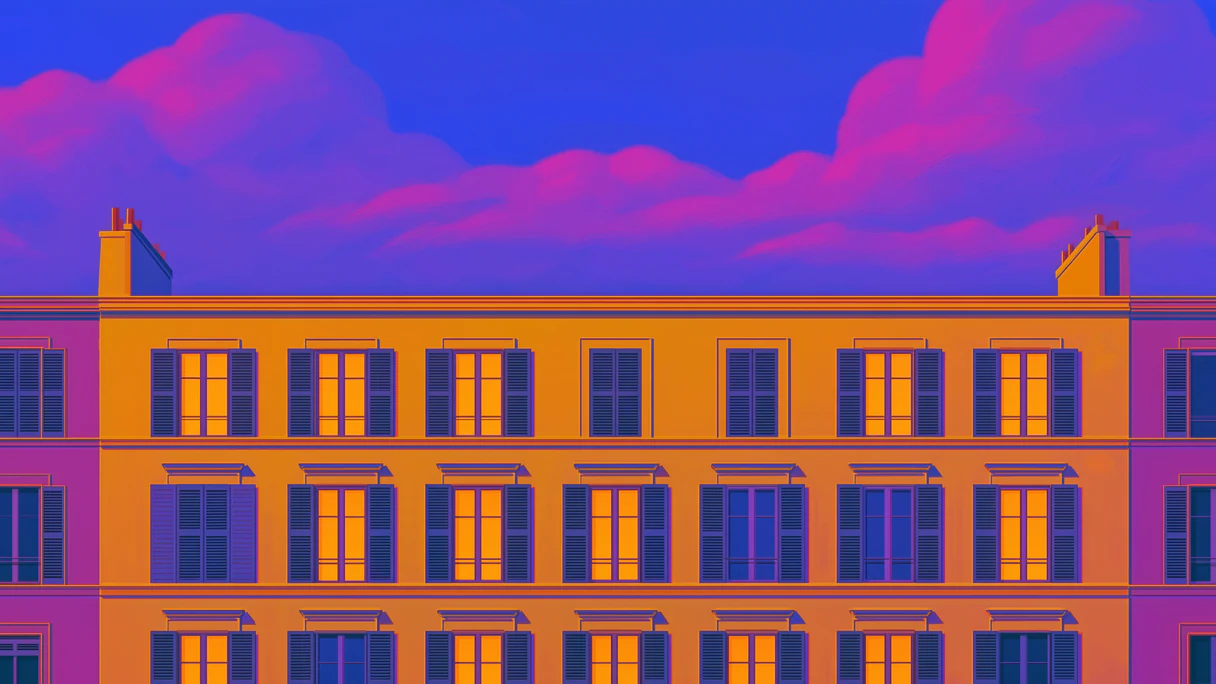 A grand building front with warm lit windows under a pink evening sky