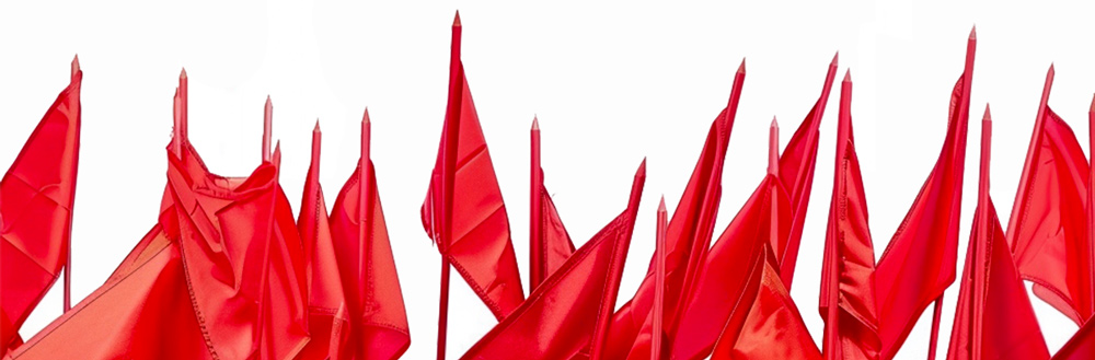 row of red flags on white background
