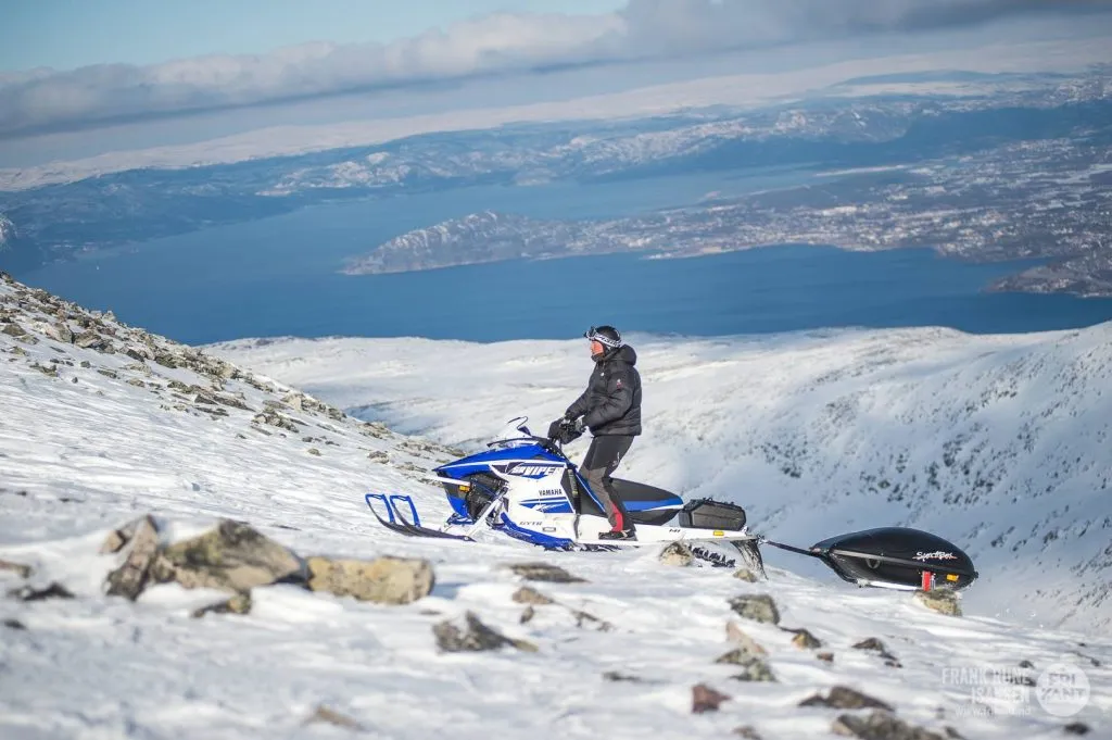 Snowmobiles on the plateau in the sunshine
