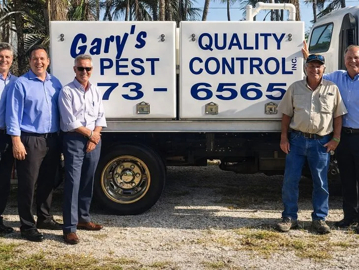 Kemp Anderson with the owners of Gary’s Quality Pest Control ahead of a planned exit