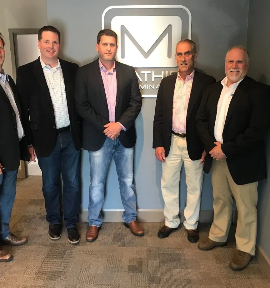 The ownership group of Mathis Exterminating at their offices