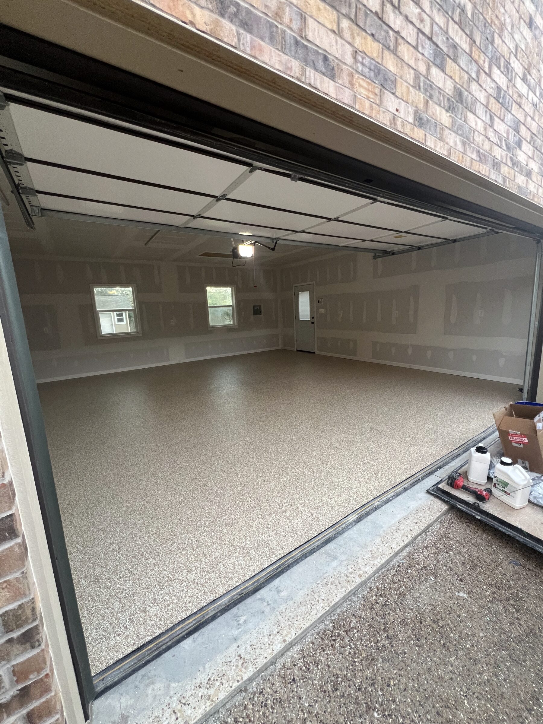 Two-car garage, tan flake