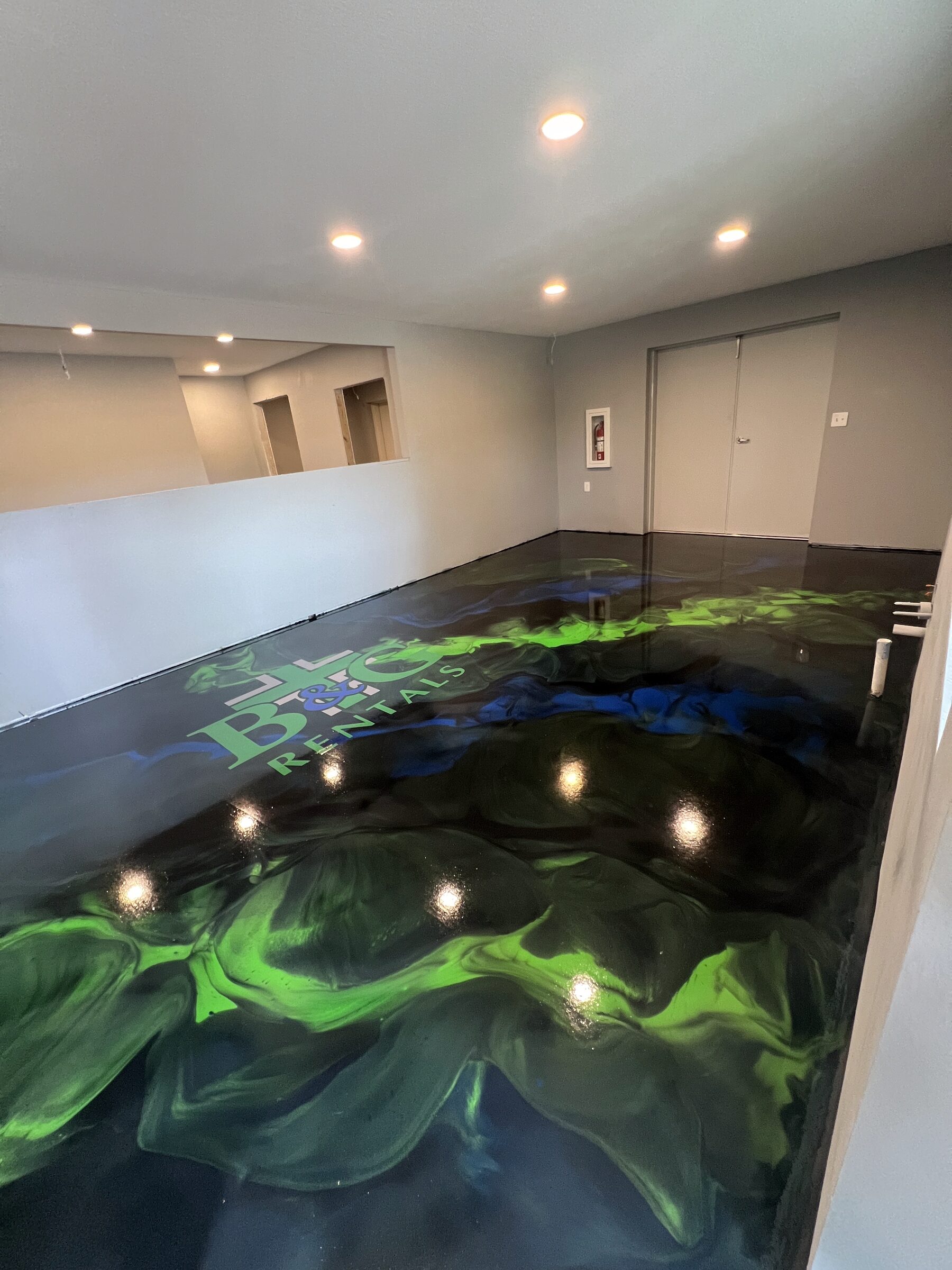 Commercial showroom, green and black metallic