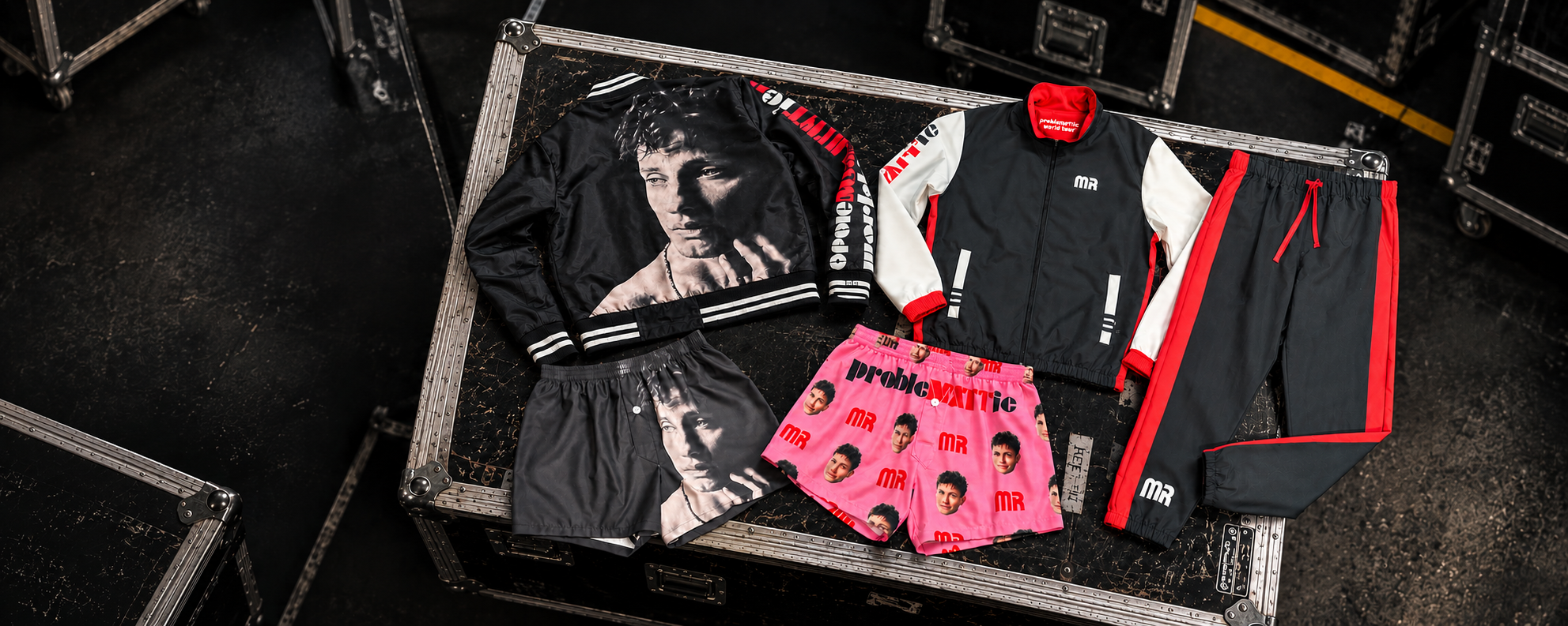 Custom artist merchandise apparel displayed in touring road cases