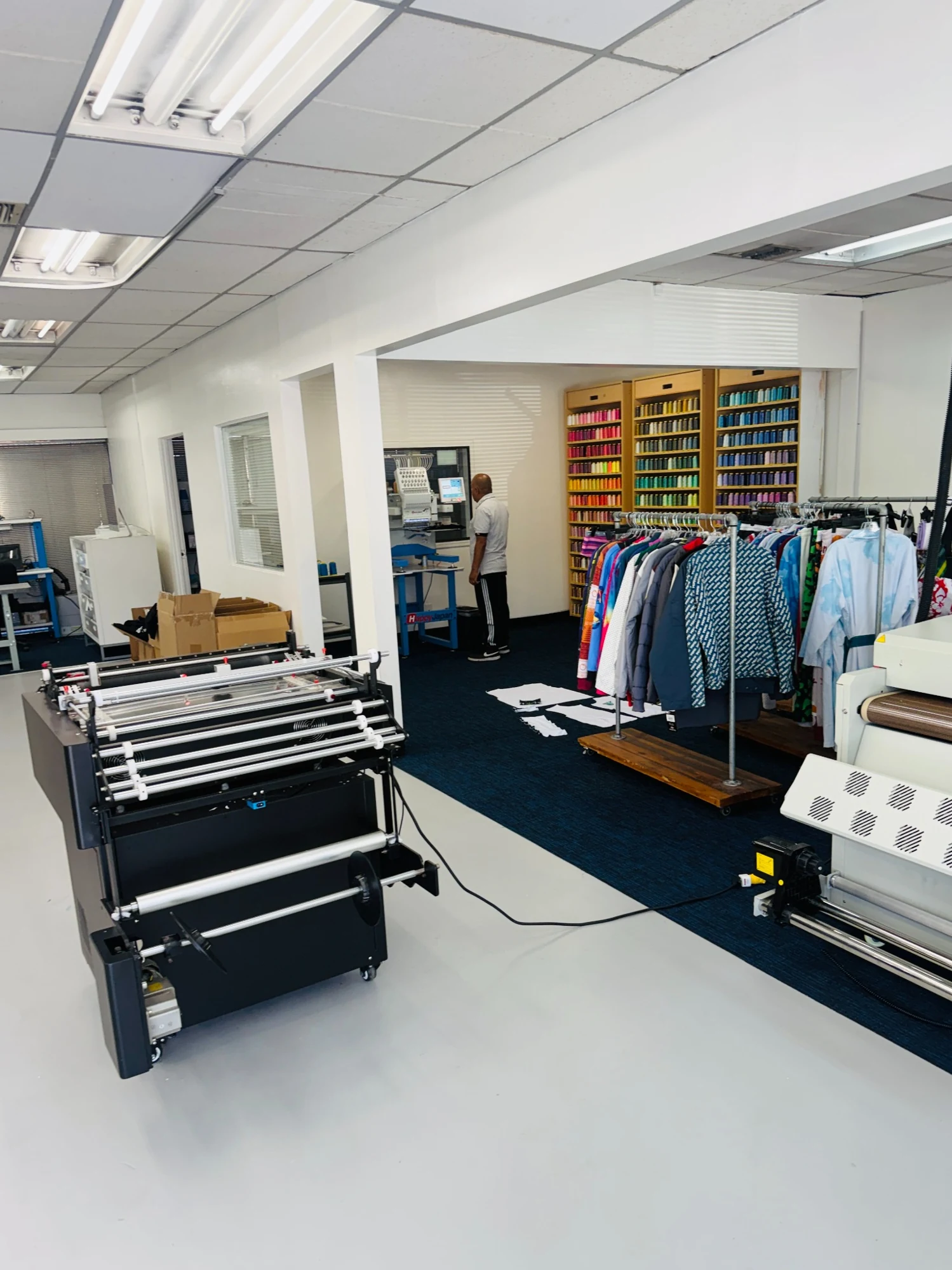 Garment samples, thread library and embroidery equipment in the Los Angeles studio