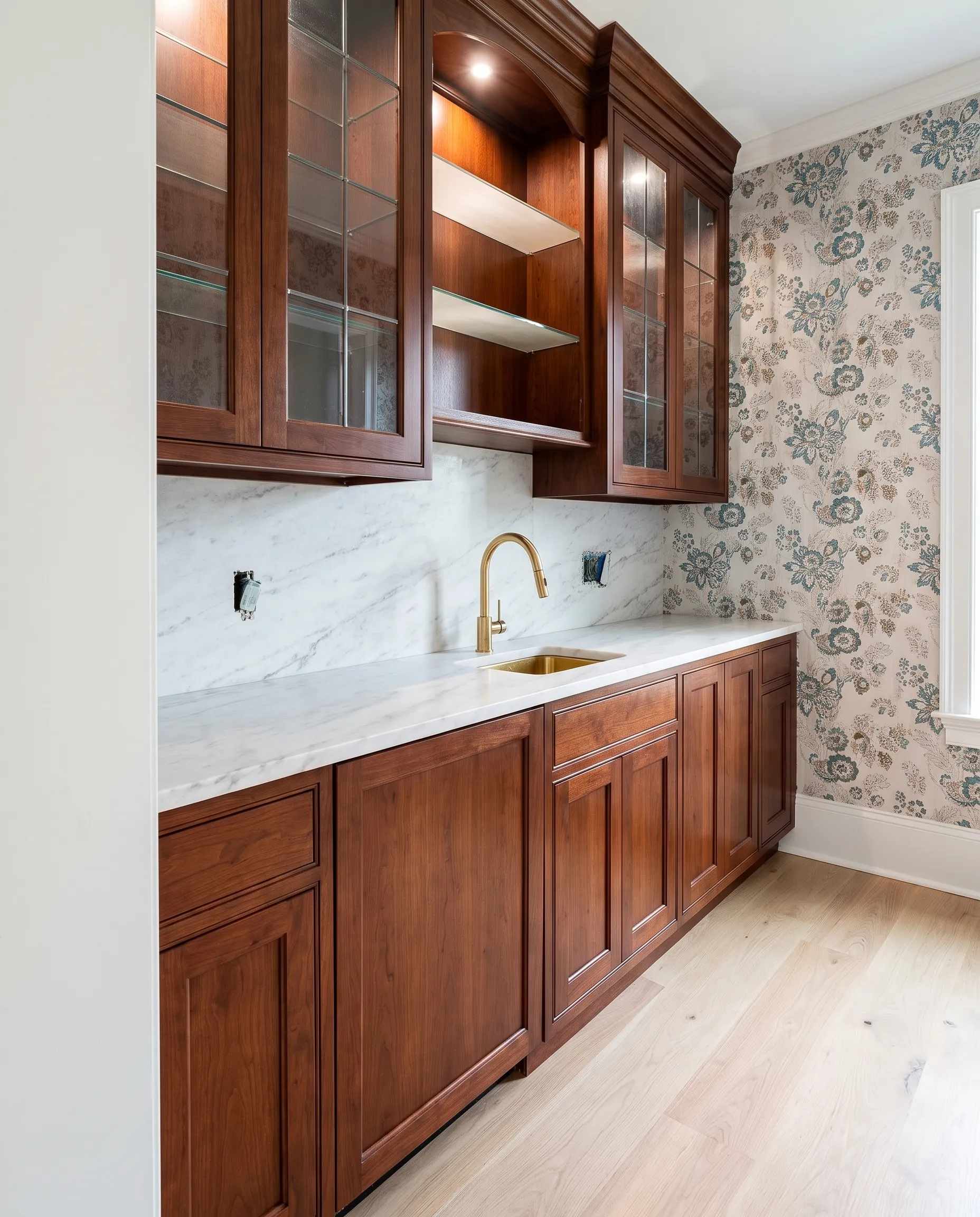 Brass faucet and vanity top being set during finish work