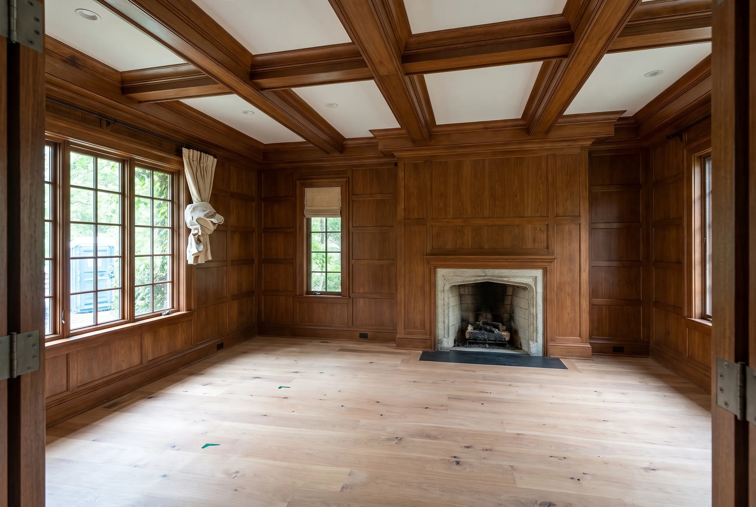 Paneled library with fitted timber cabinetry