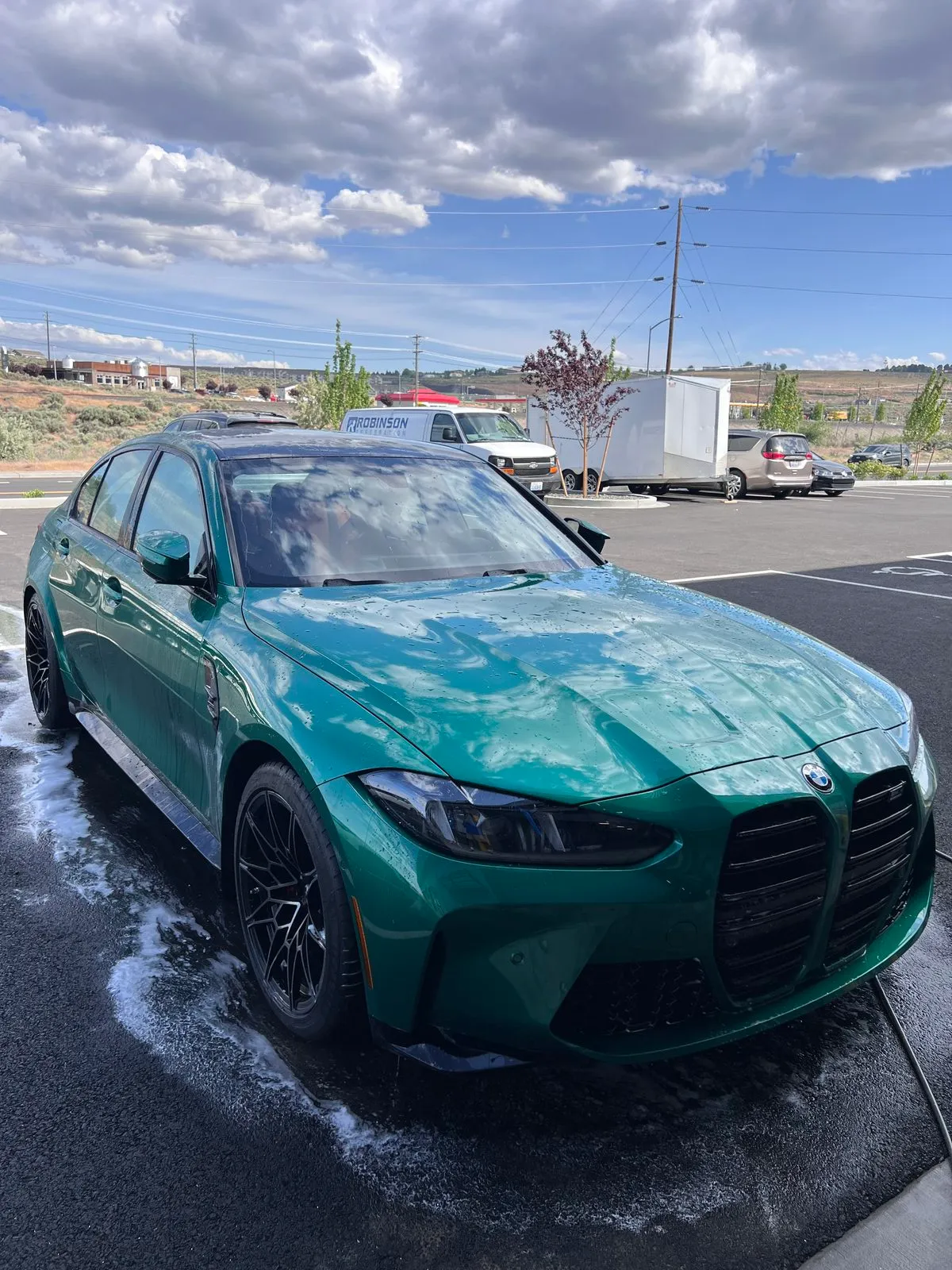 Full detail on a green BMW M3