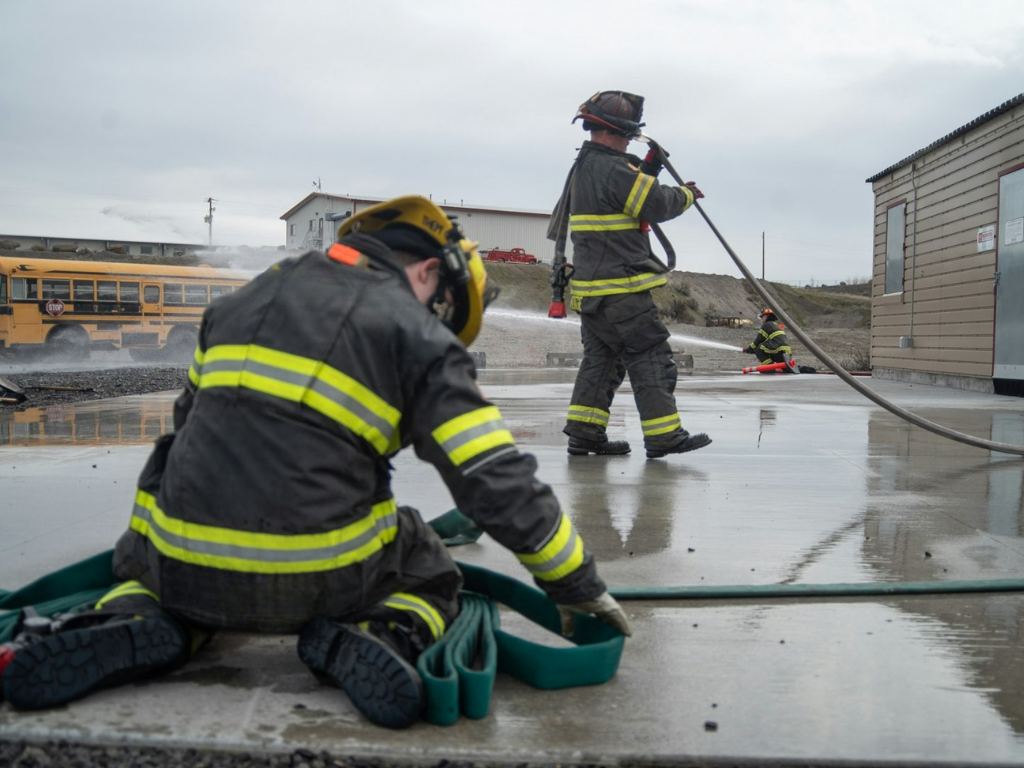 Firefighters training with hose lines