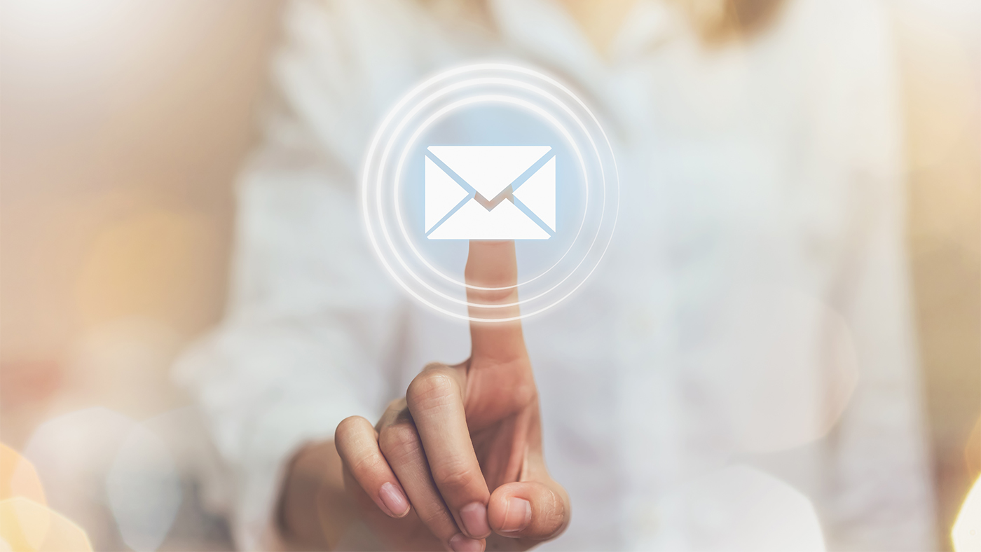 A person pressing a floating email icon to conduct a cold outreach attempt.