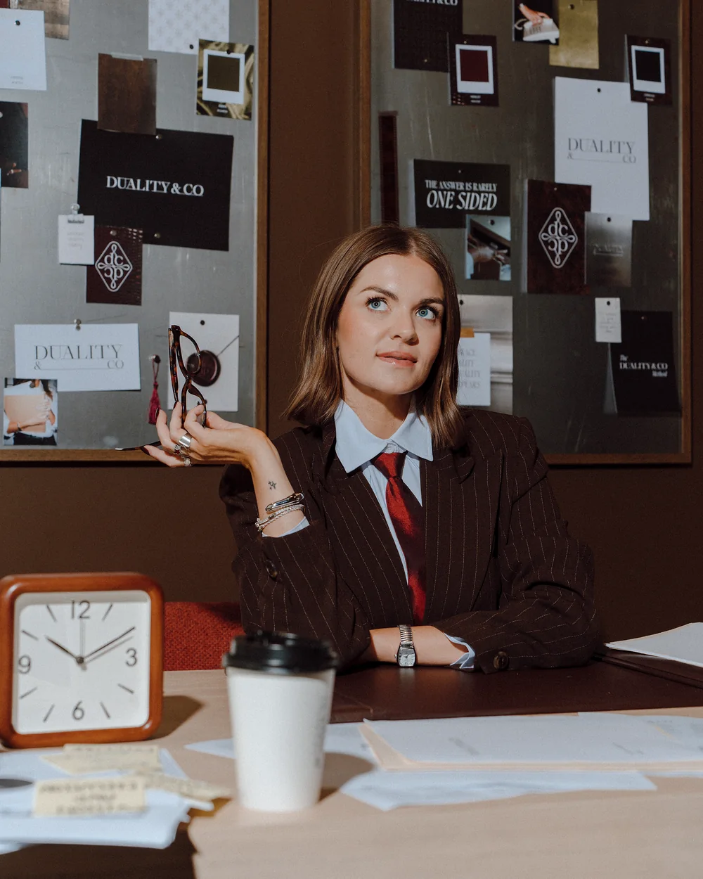 A Duality & Co. strategist reviewing client results at her desk.