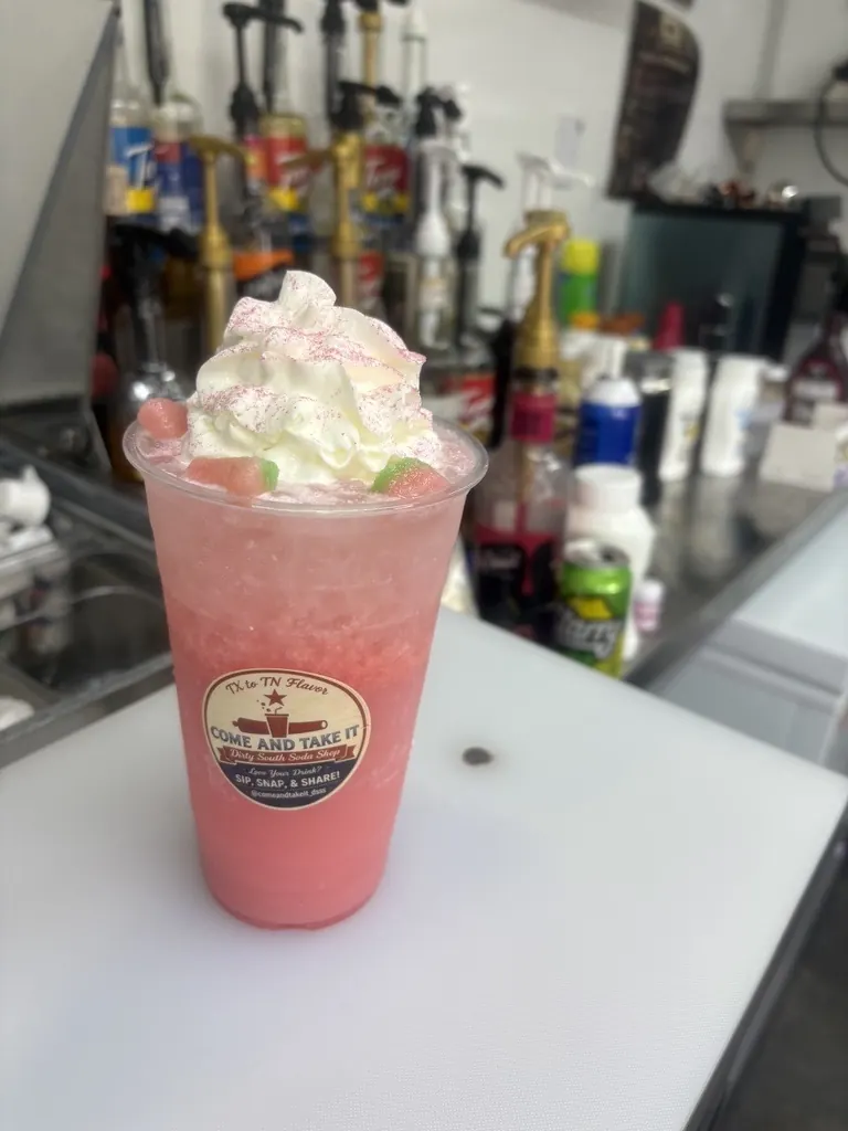 Specialty dirty soda topped with whipped cream