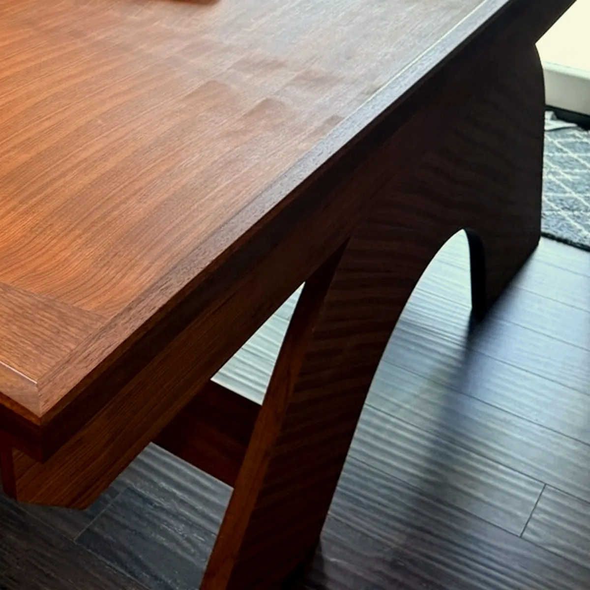 Solid walnut Vortex468 game table with its curved base