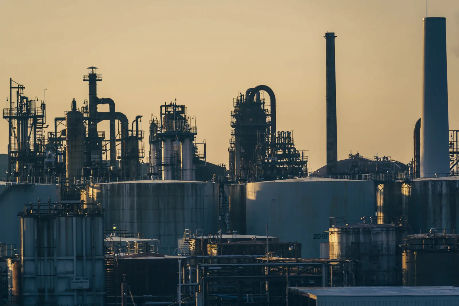 Refinery and storage tanks at golden hour
