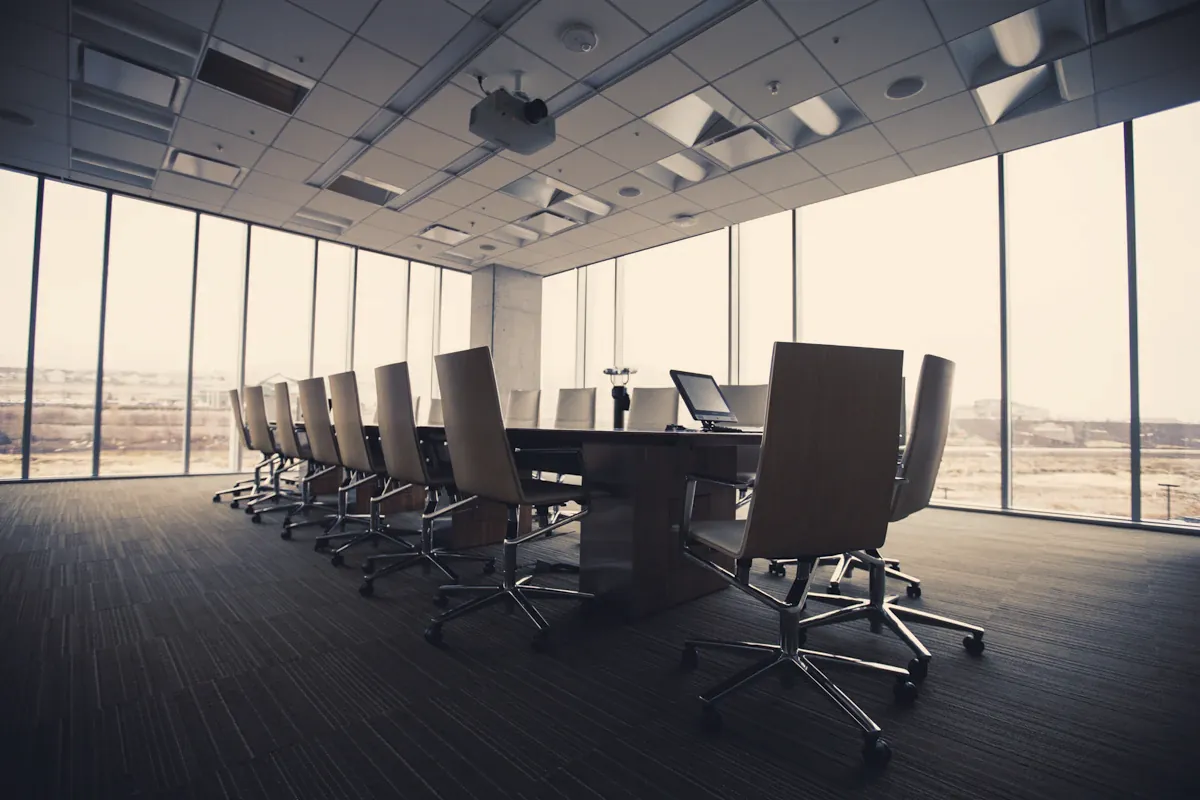 Empty boardroom with a long conference table