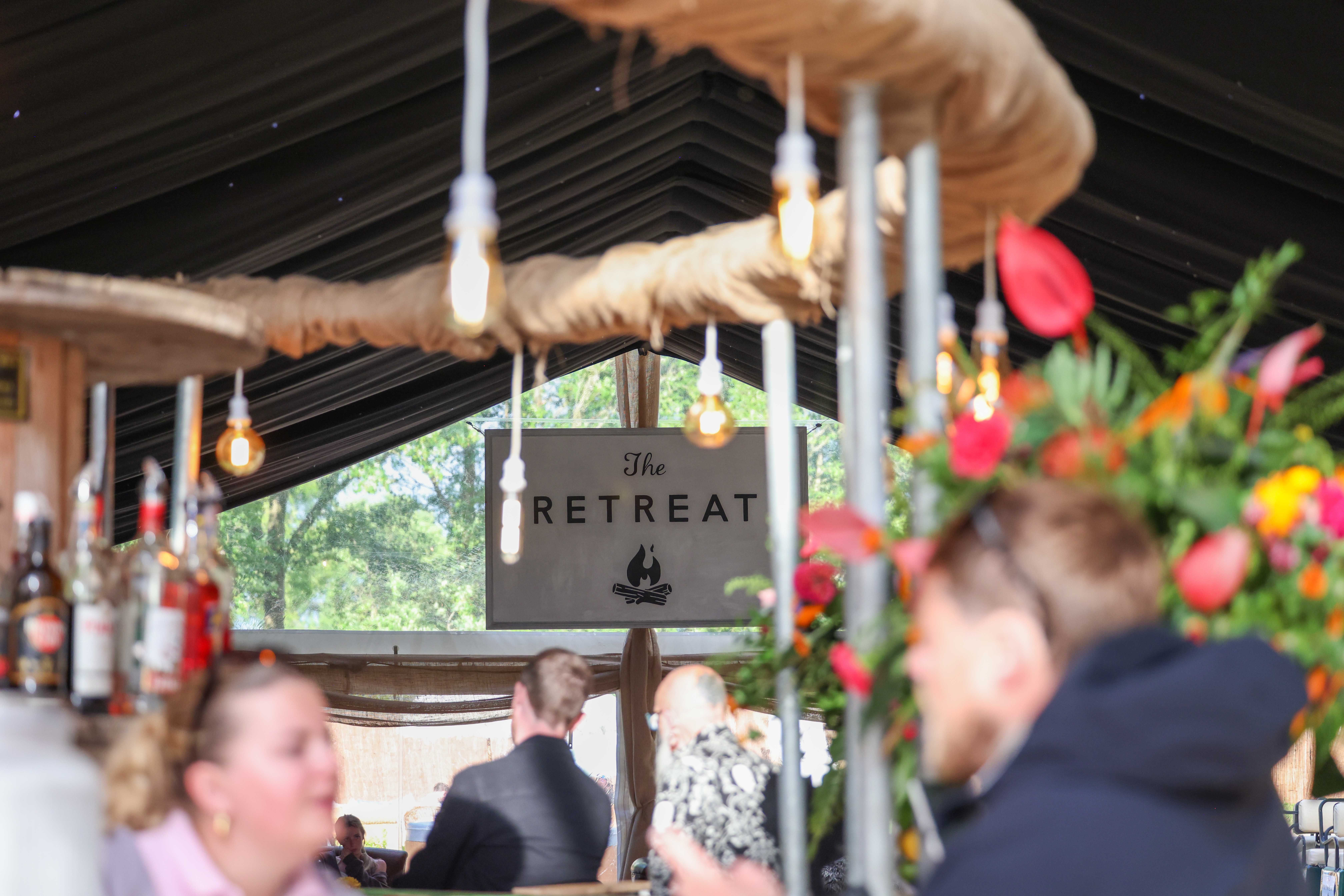 Guests dining and socialising at The Retreat event