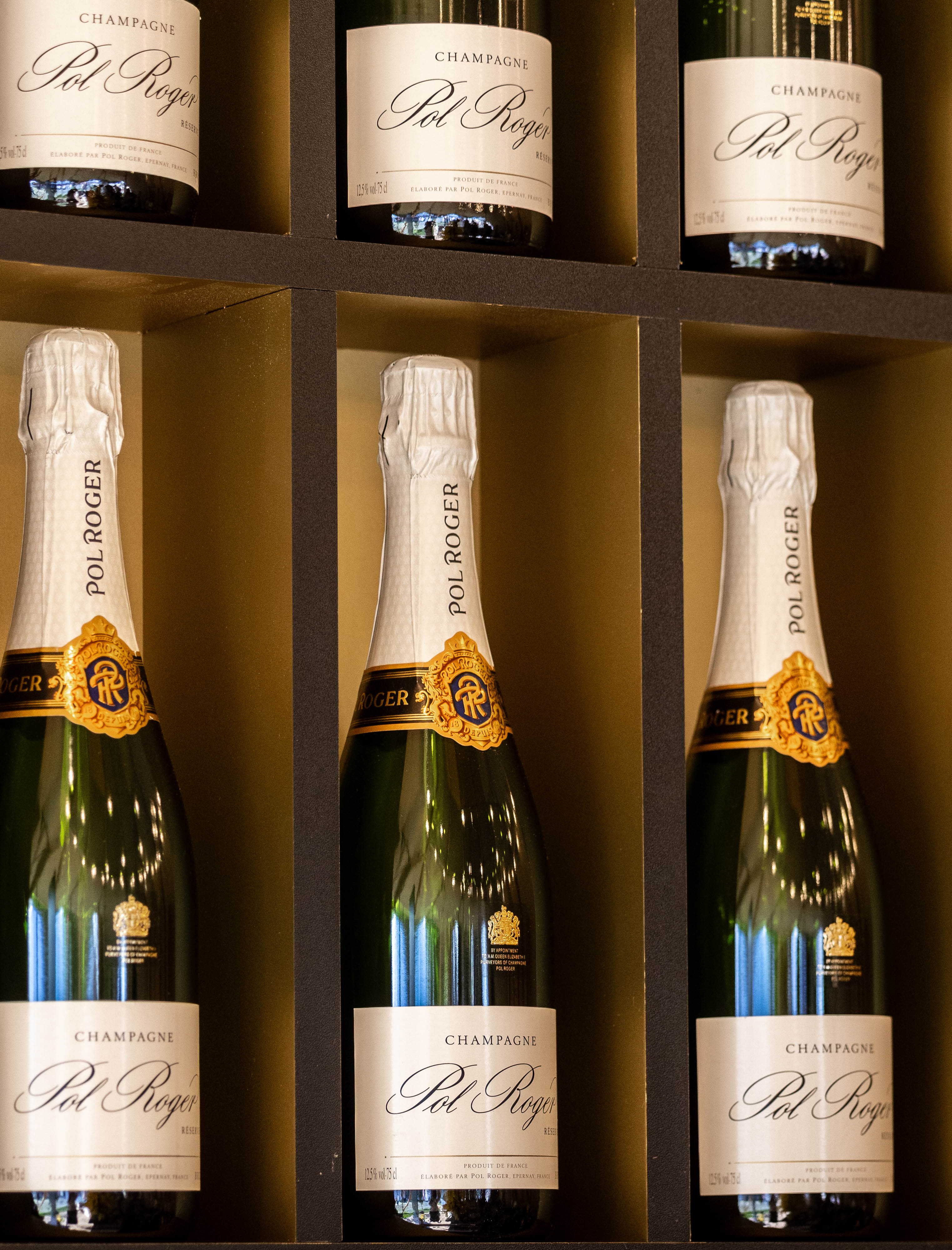 Pol Roger champagne bottles displayed for a premium brand event