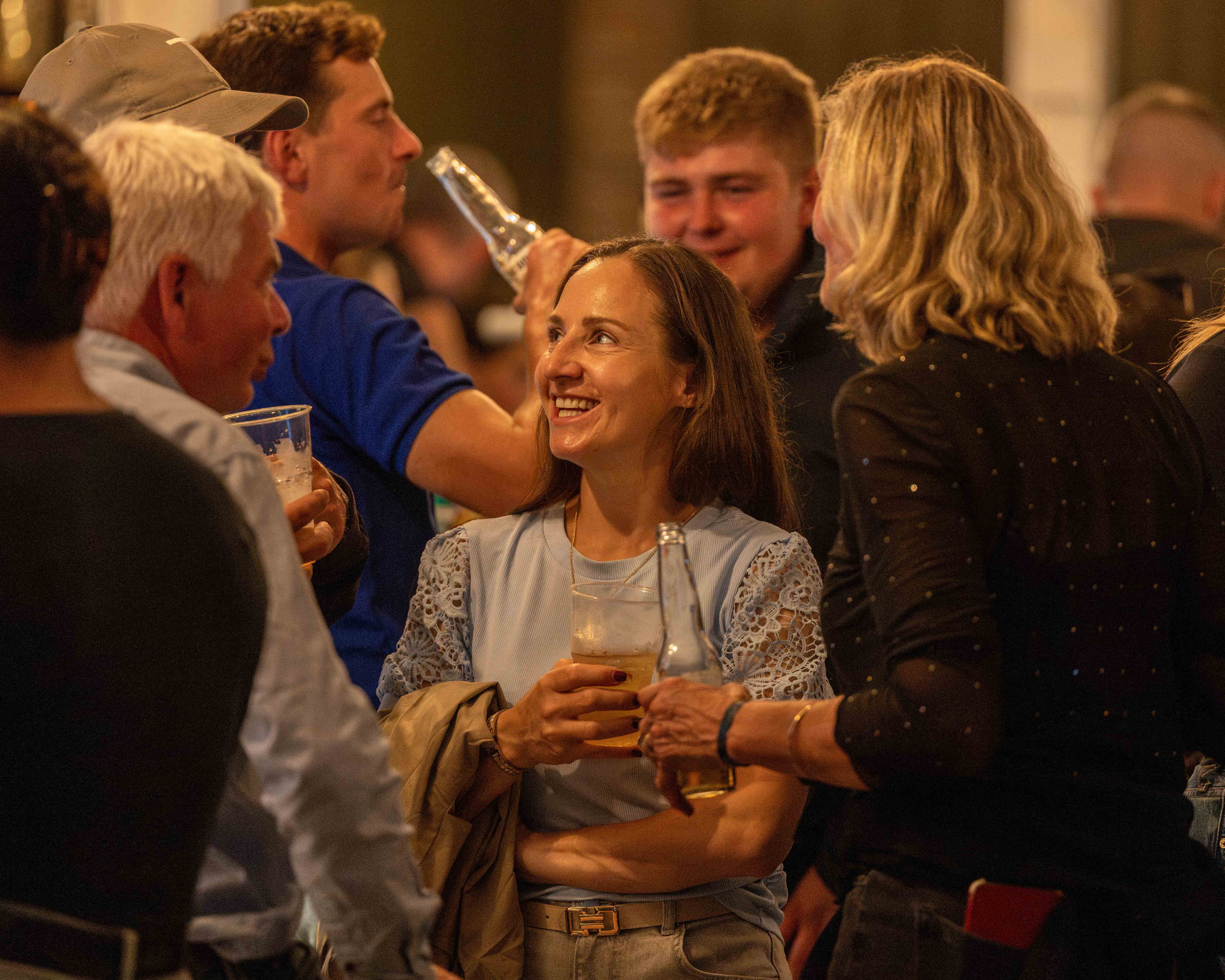 Guests enjoying drinks at a bar