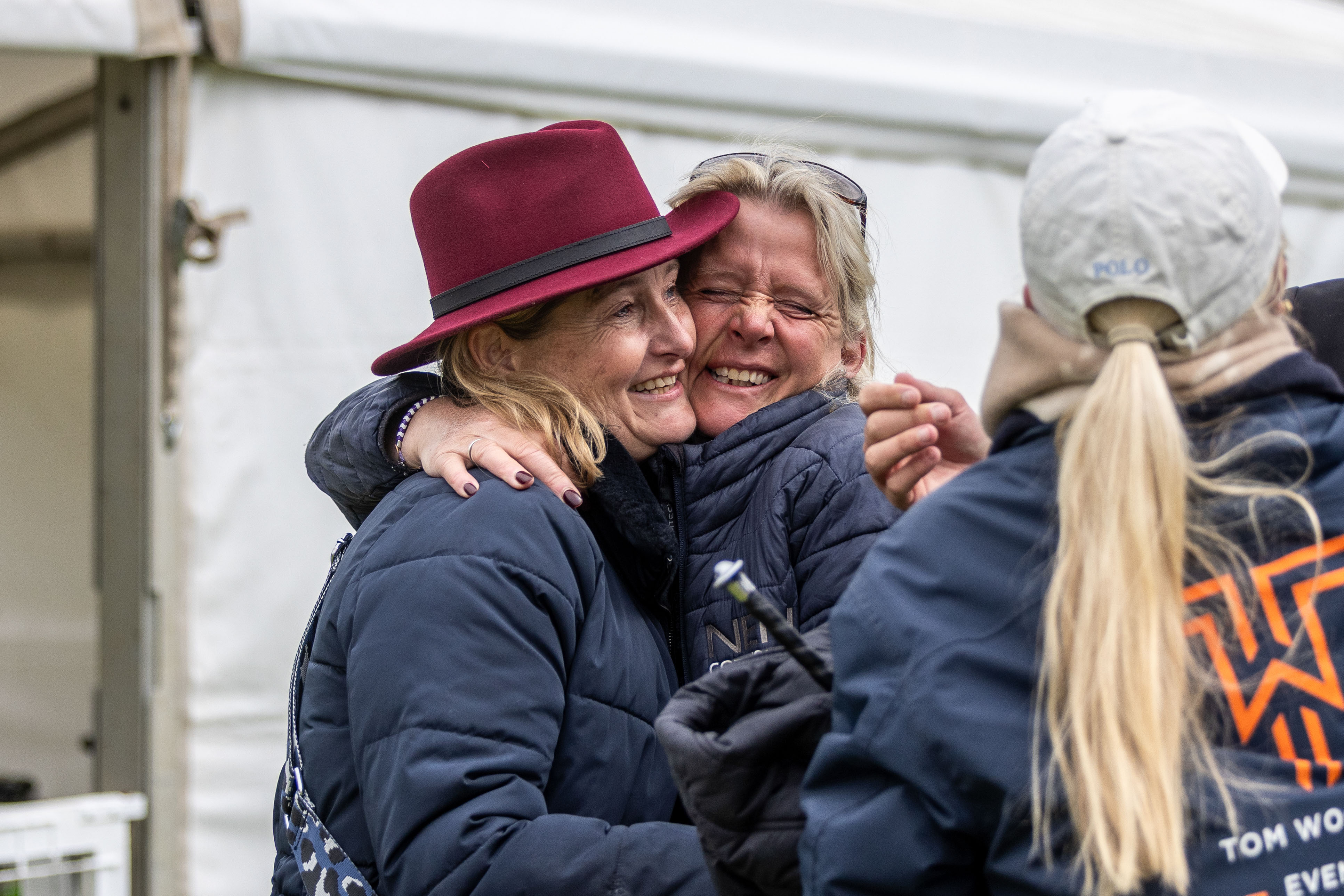 Spectators celebrating at an equestrian event
