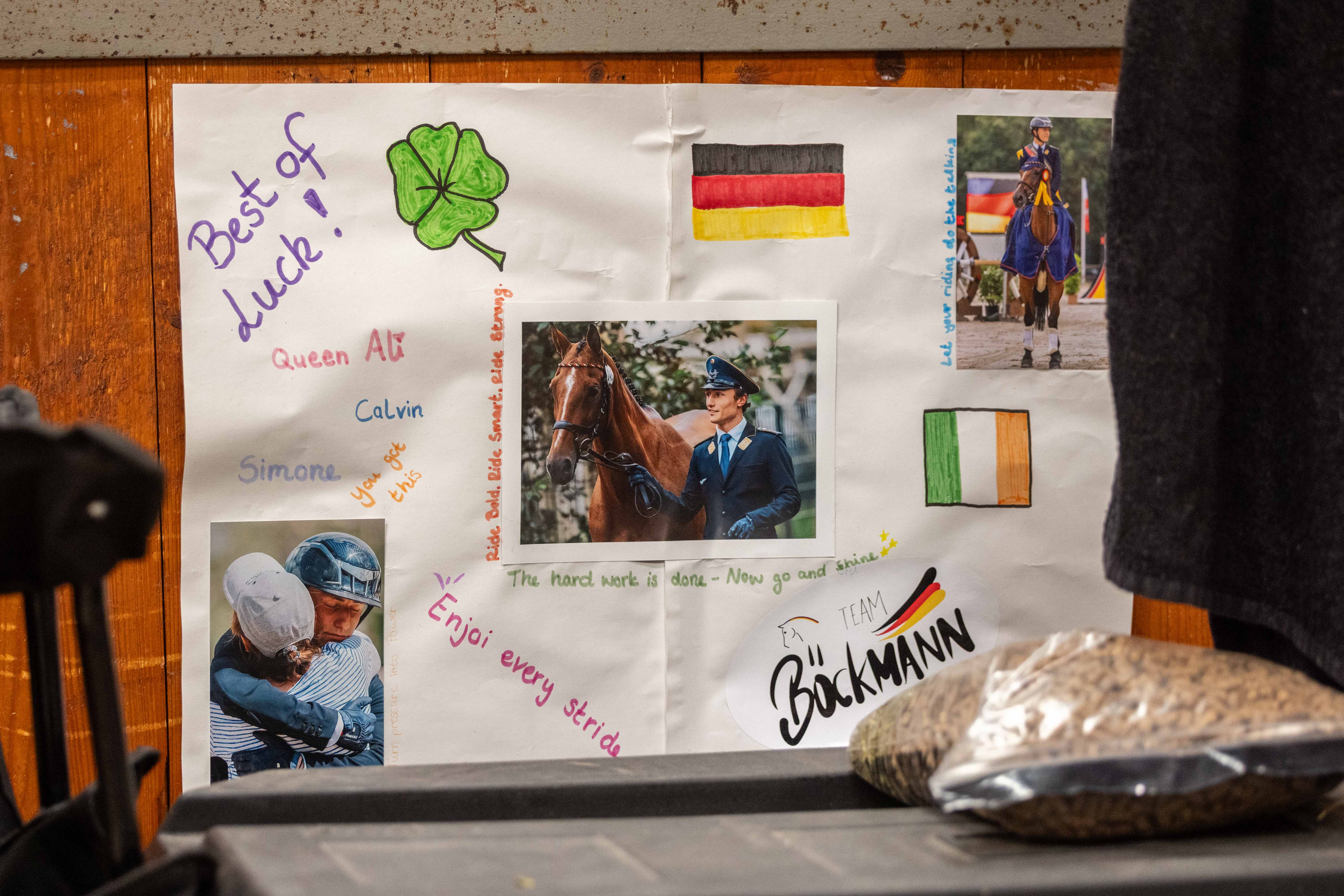 Good Luck poster displayed alongside photographs