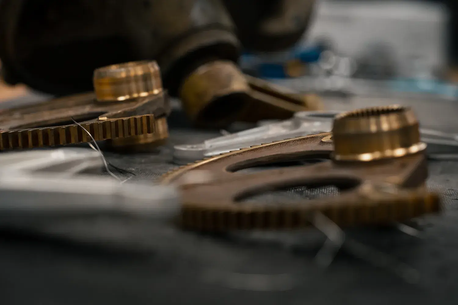 Close-up of brass and steel gears from an aircraft accessory on a workbench
