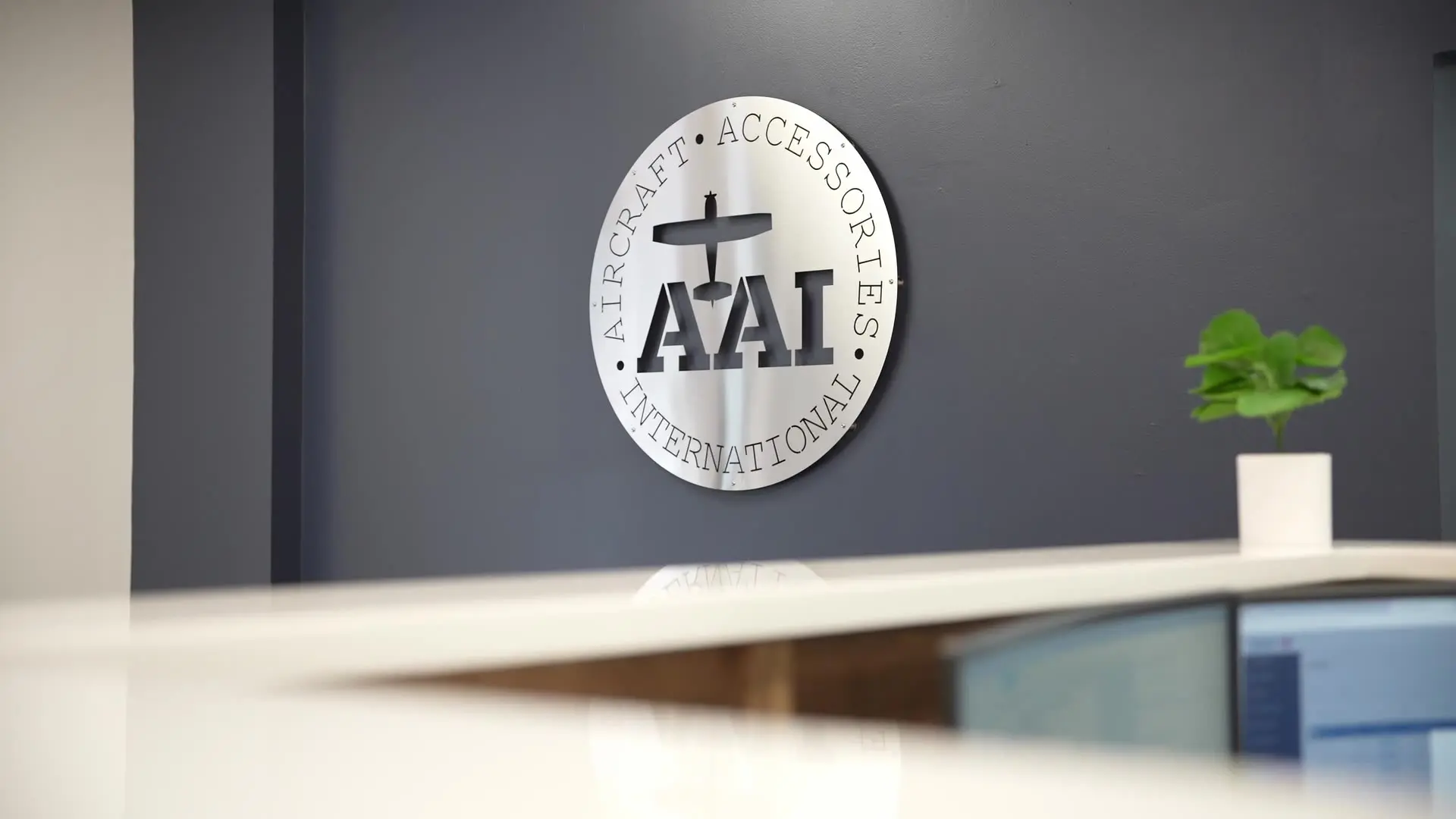 Aircraft Accessories International AAI logo sign on the wall of the Newnan office
