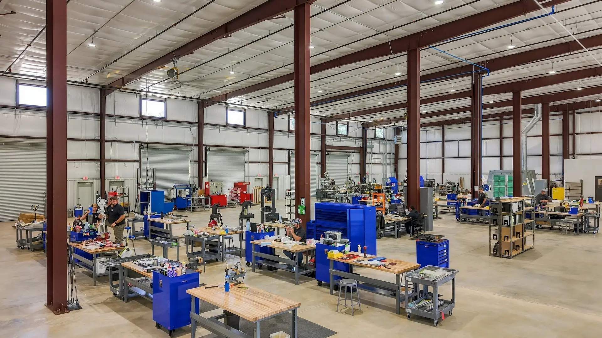 Inside AAI's new Newnan, Georgia facility, with technicians working at benches across the open shop floor